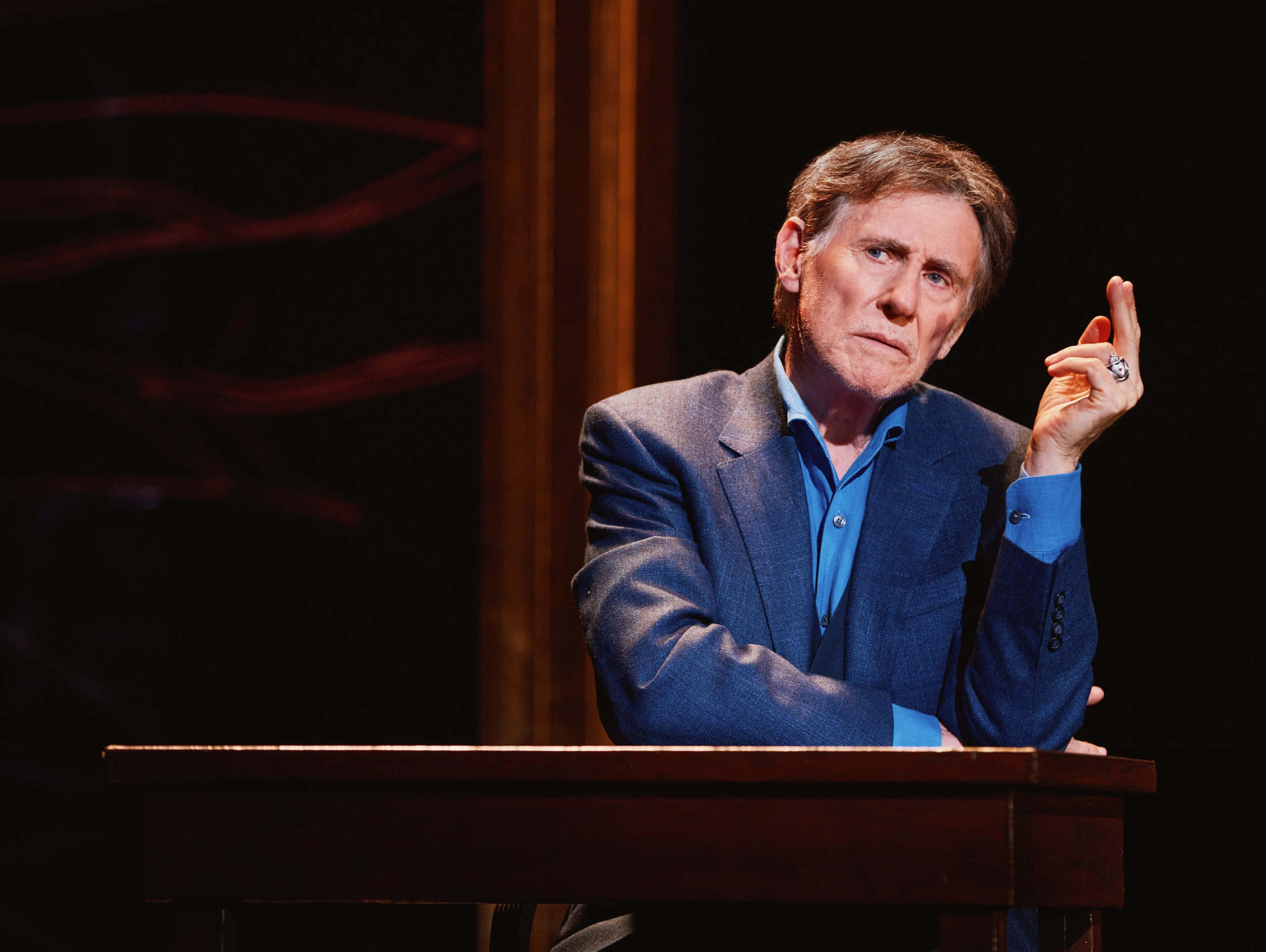 Gabriel Byrne, blue suit, wooden podium, 2K Desktop Wallpaper
