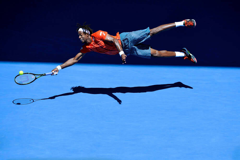 Gael Monfils, vibrant blue court, bright stadium lights, SD Desktop Wallpaper