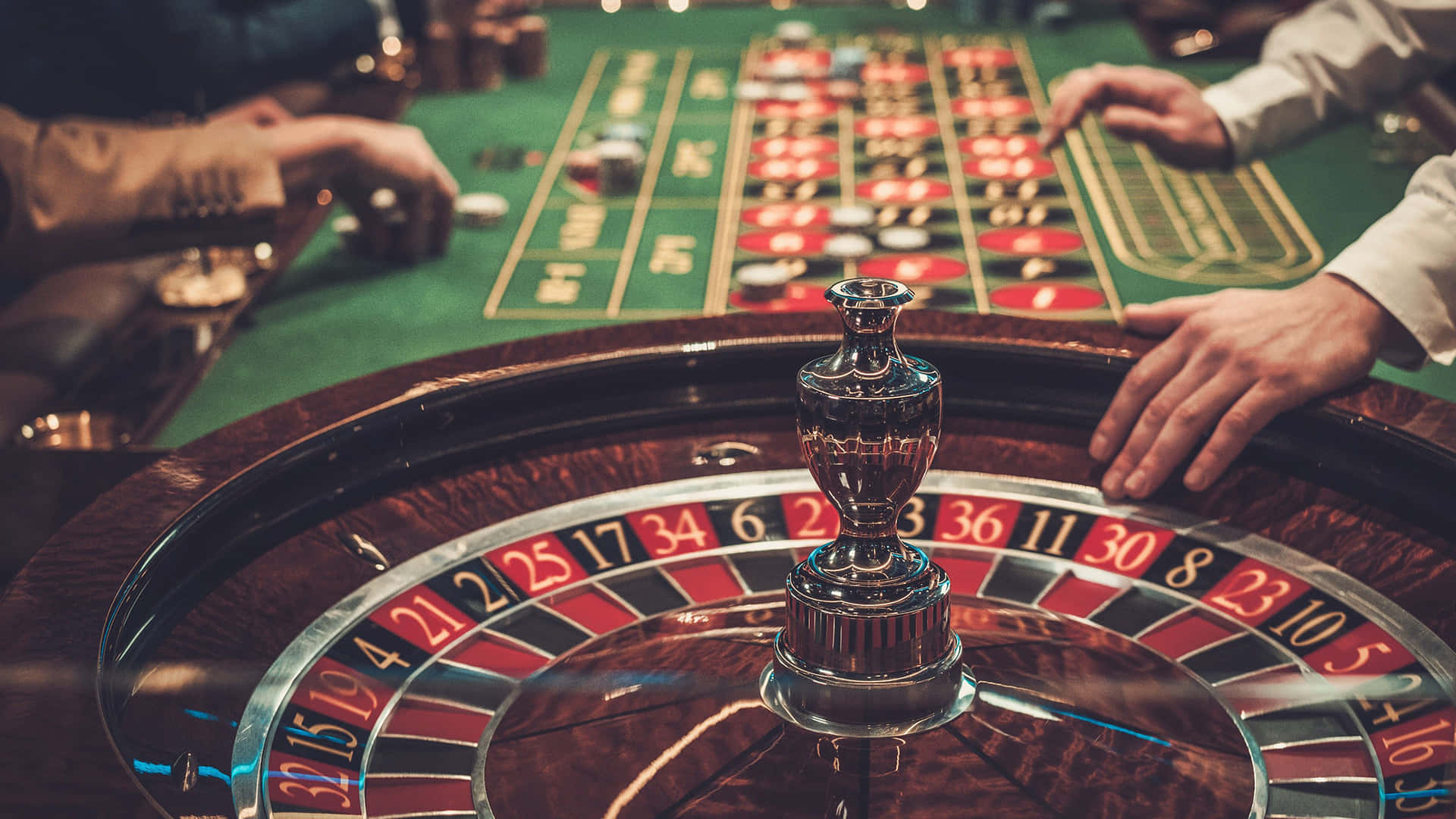 roulette wheel, green felt casino table, hands placing bets, Full HD Desktop Wallpaper