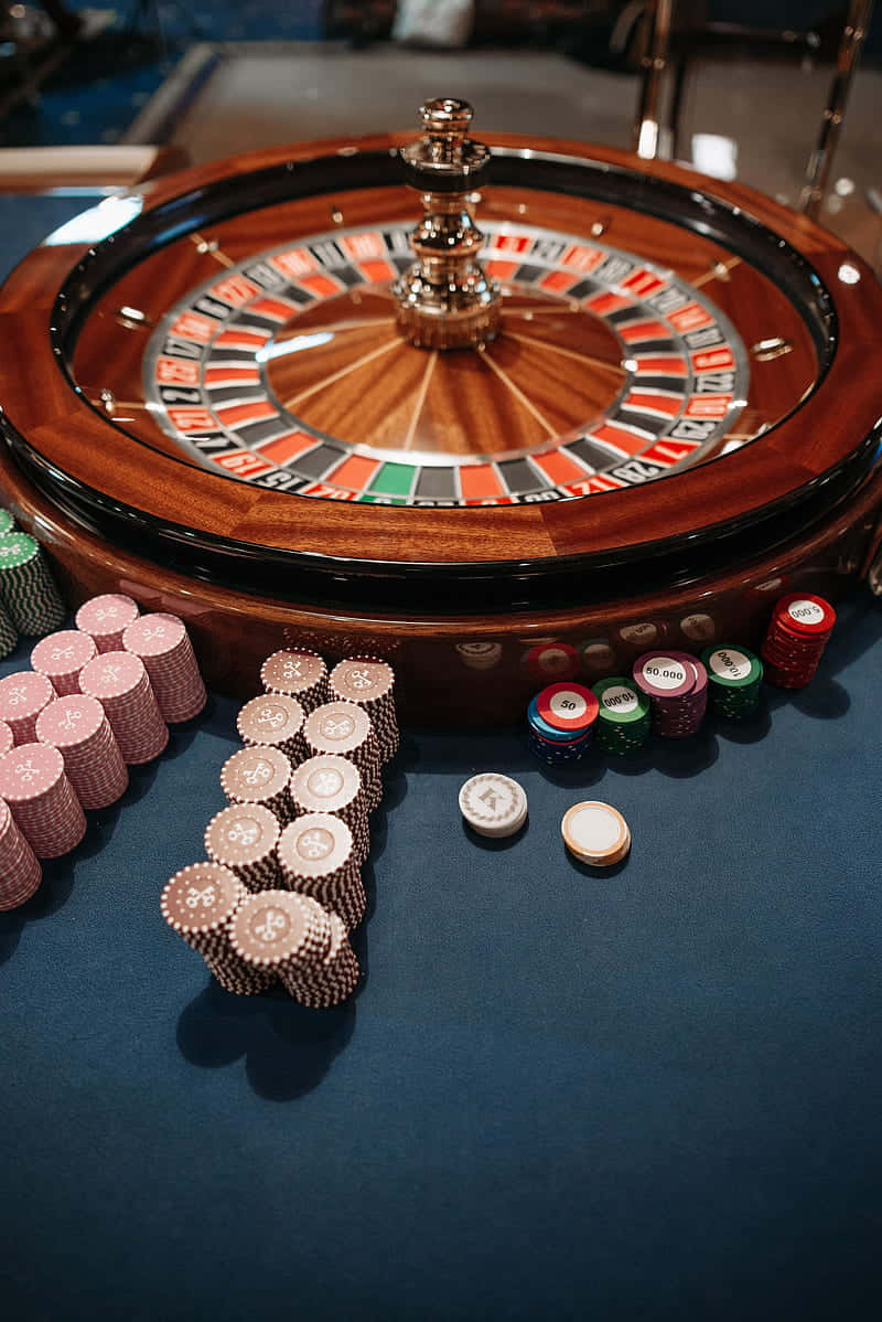 roulette wheel, red black and green numbered slots, colorful casino chips, SD Phone Wallpaper
