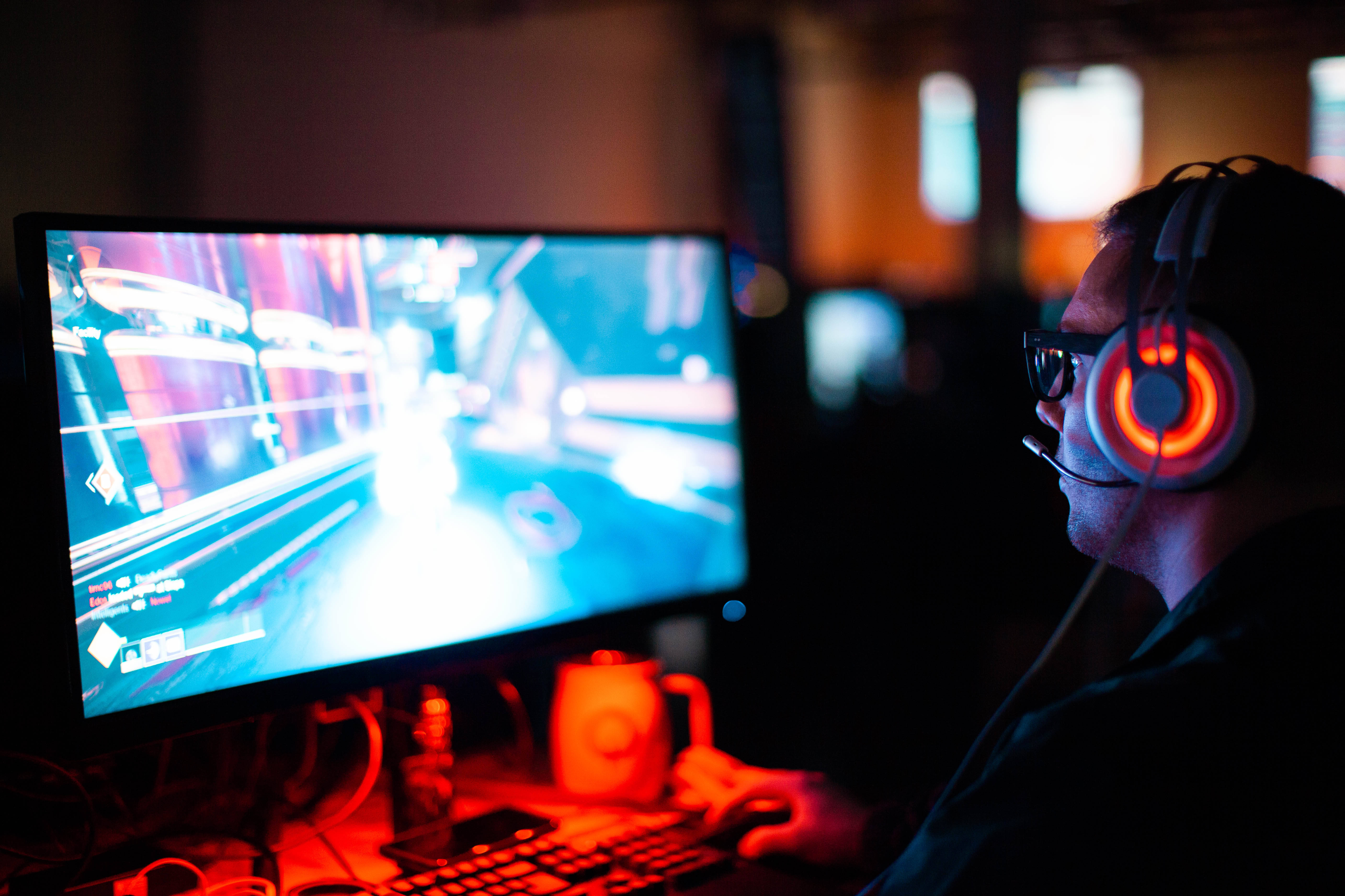 gamer, glowing red headphones, fast-paced racing game, 5K Desktop Wallpaper