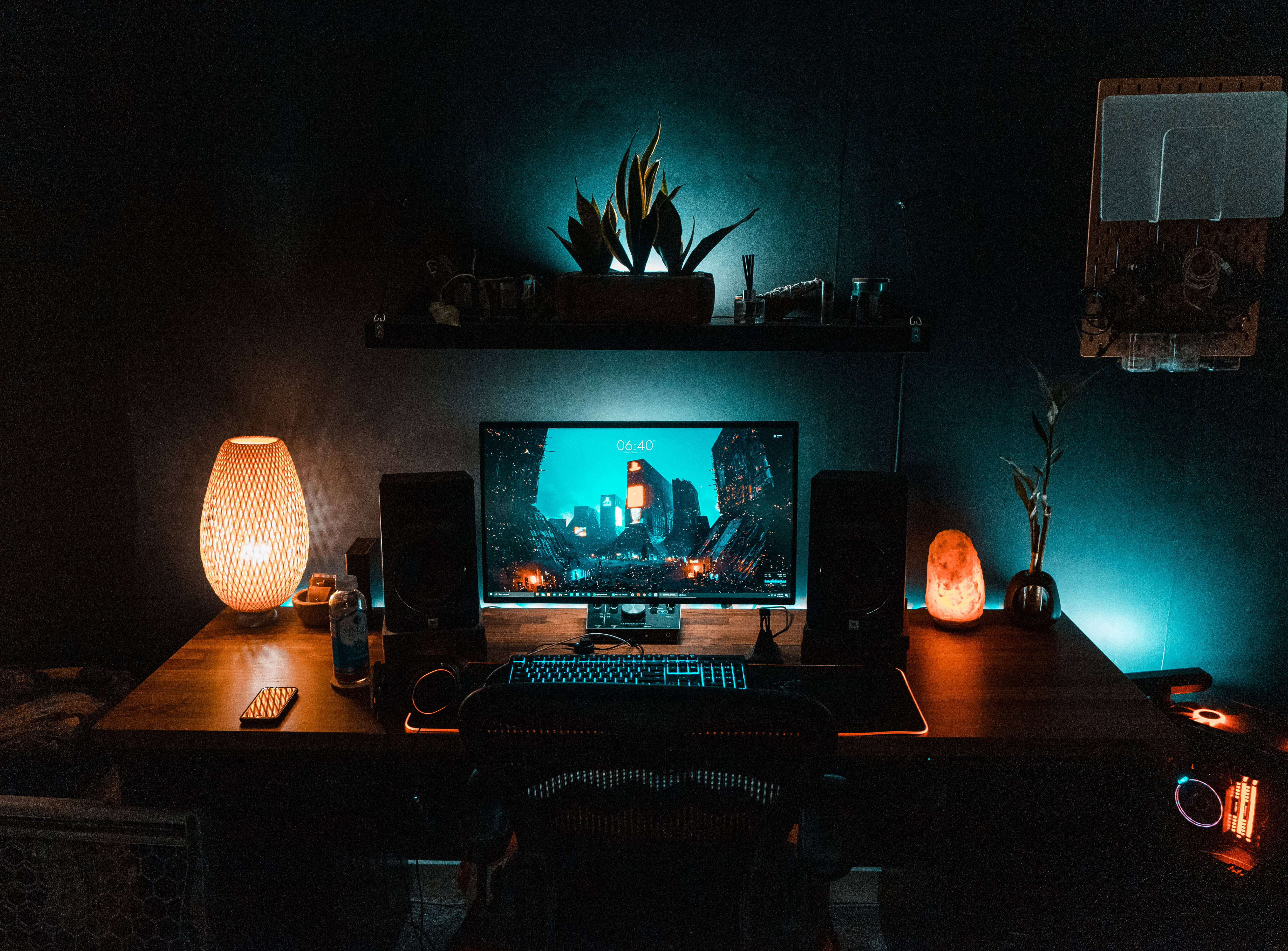 gaming room, glowing orange lamps, blue-lit monitor, 5K Desktop Wallpaper