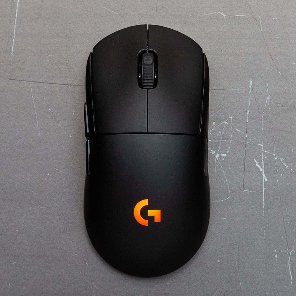 Logitech gaming mouse, glowing orange logo, black, SD Desktop Wallpaper