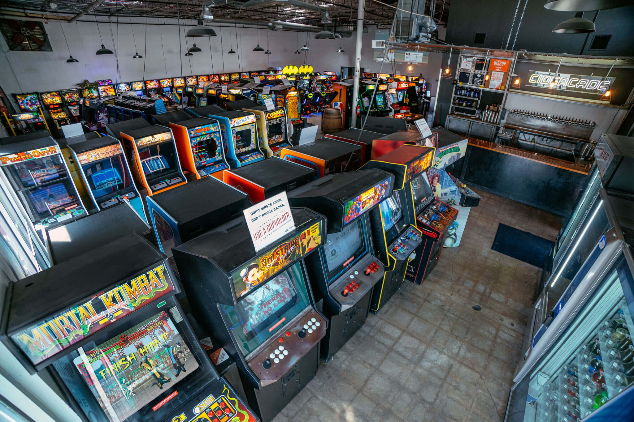 vintage arcade machines, glowing screens, colorful cabinets, Full HD Desktop Wallpaper