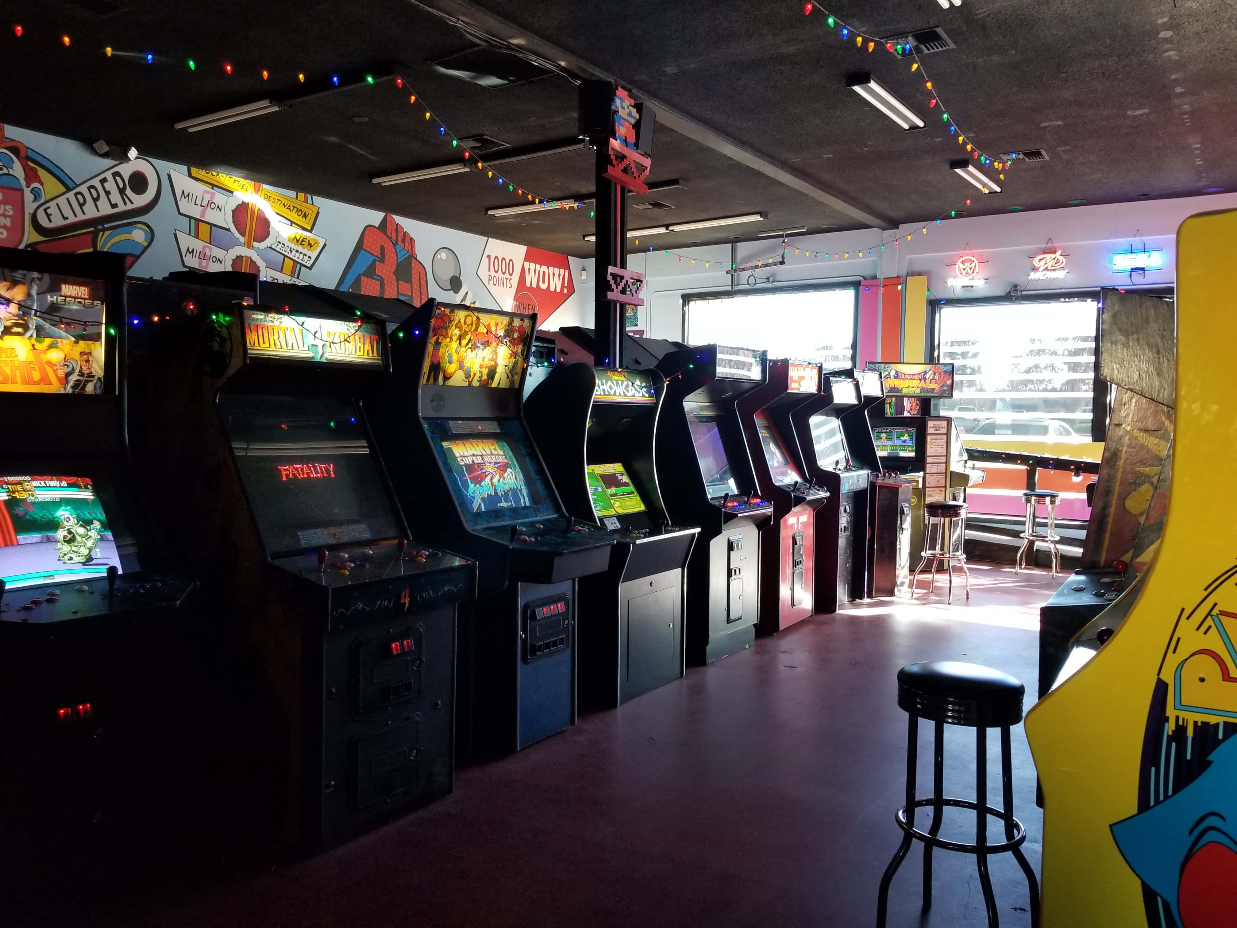 vintage arcade machines, colorful string lights, retro gaming lounge, 4K Desktop Wallpaper