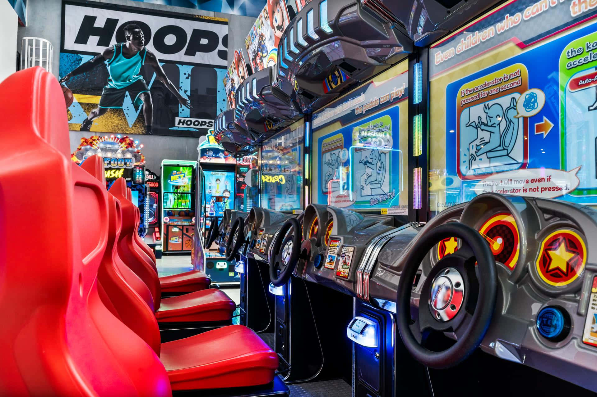 arcade room, red racing seats, glowing steering wheel game machines, Full HD Desktop Wallpaper