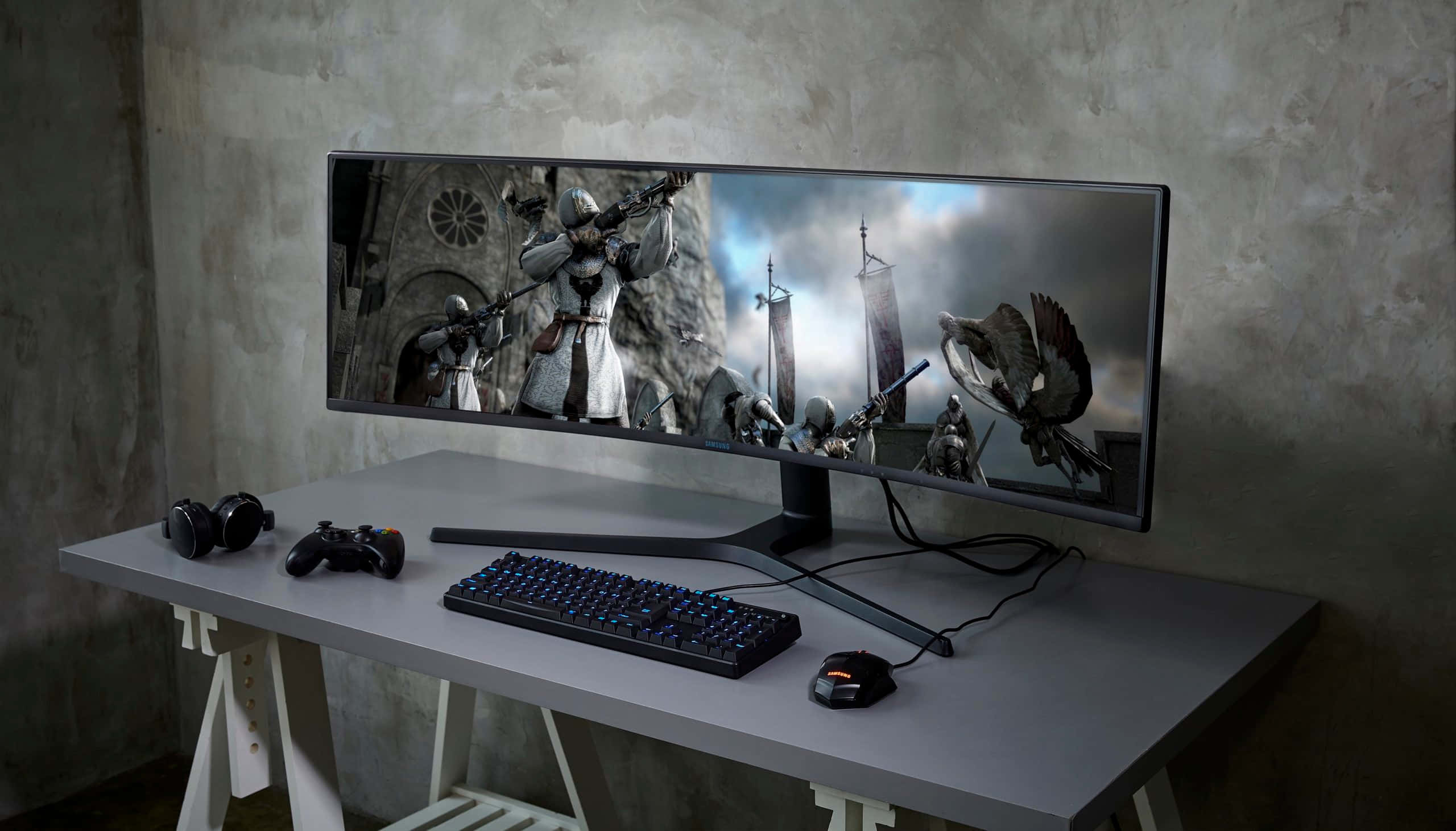 curved gaming monitor, medieval fantasy battle scene, minimalist desk, 2K Desktop Wallpaper