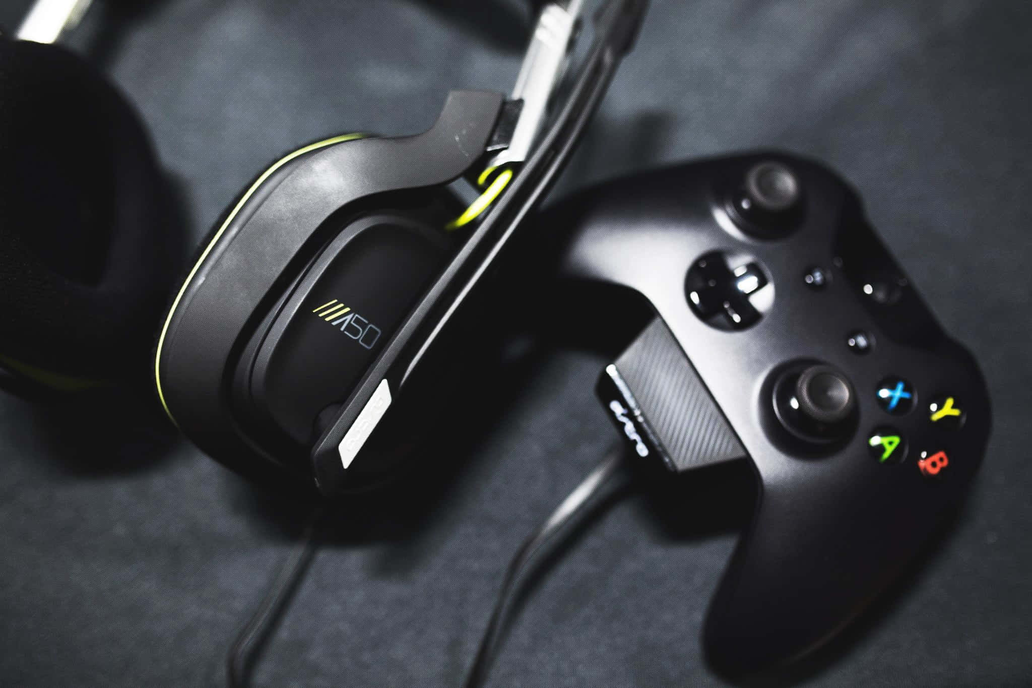 black gaming headset, neon green accents, controller, Full HD Desktop Wallpaper