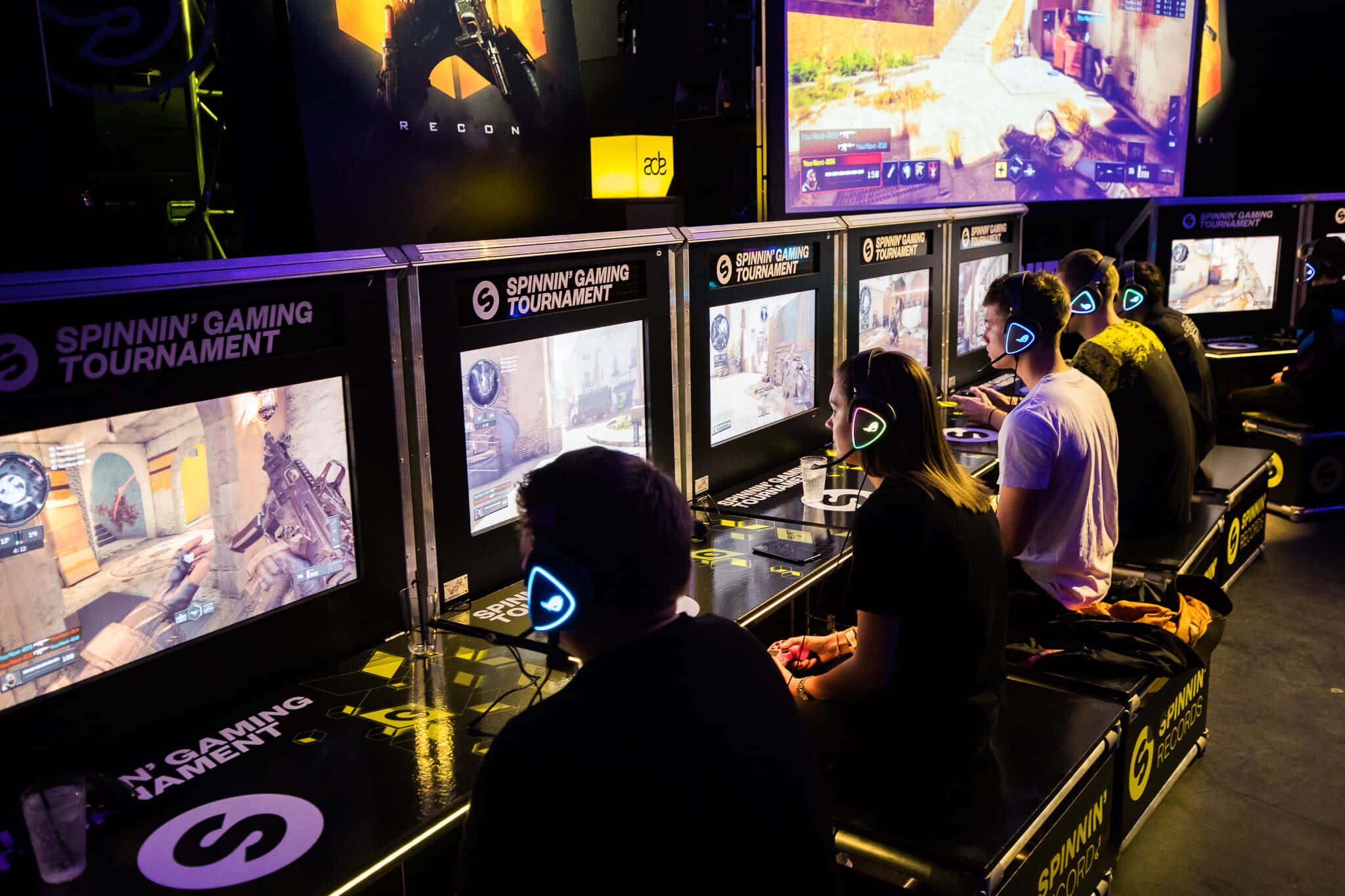 gaming tournaments, glowing monitors, dimly lit tournament arena, Full HD Desktop Wallpaper