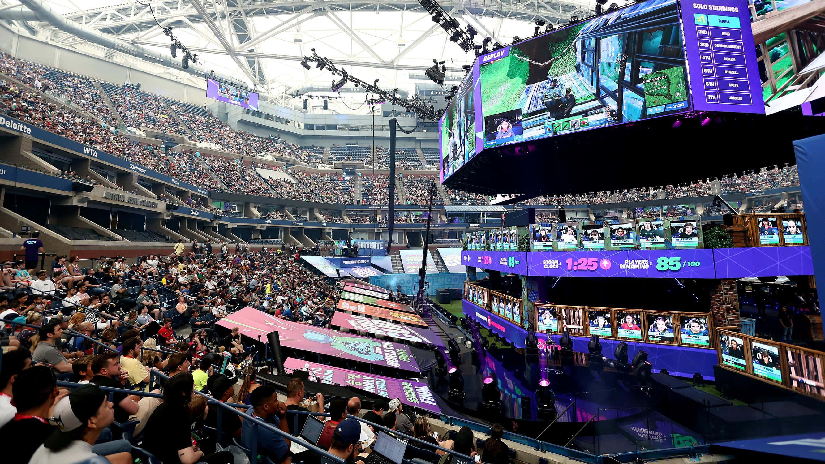 esports arena, glowing screens, cheering crowds, 2K Desktop Wallpaper