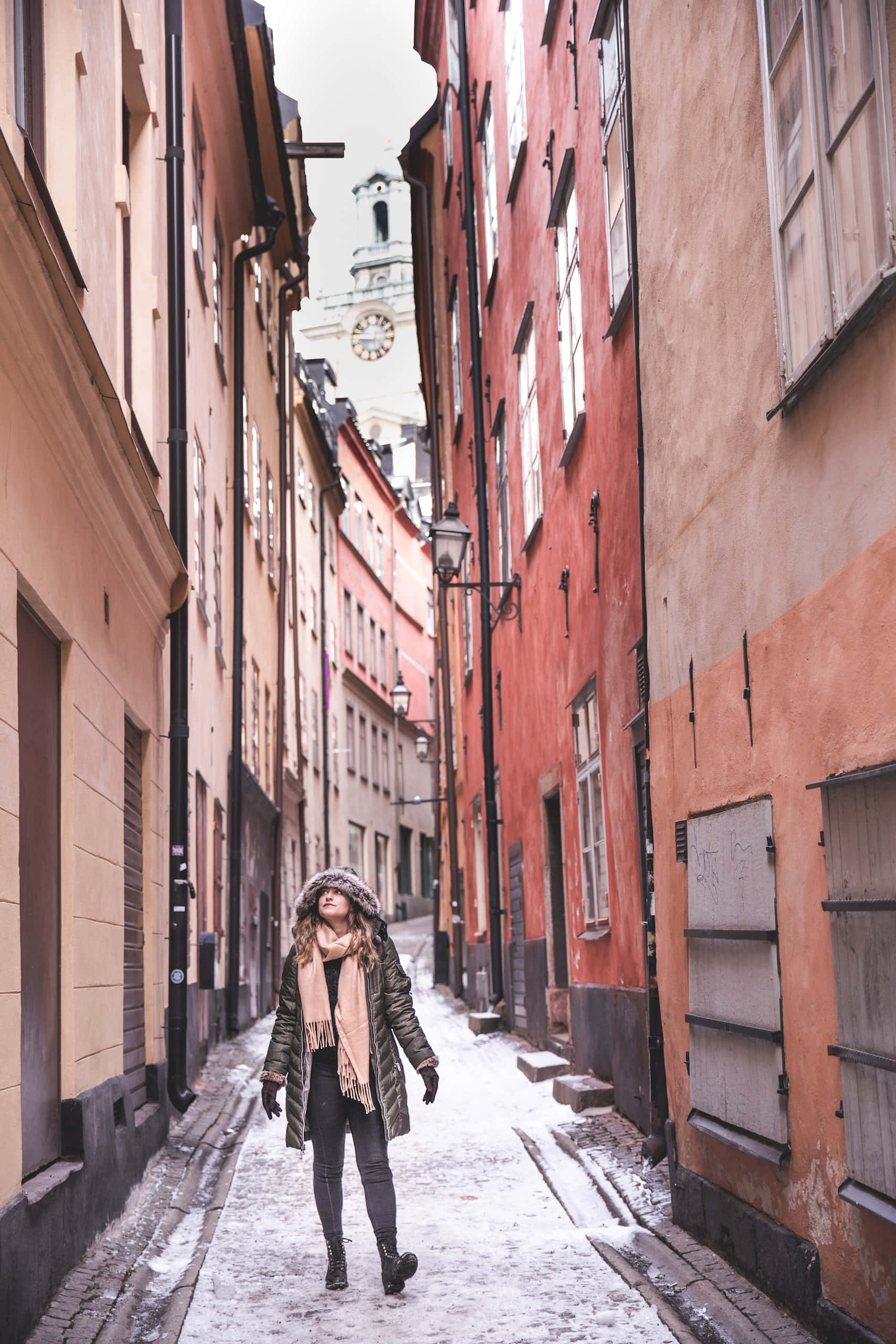 Gamla Stan, narrow cobblestone alley, colorful historic buildings, 2K Phone Wallpaper