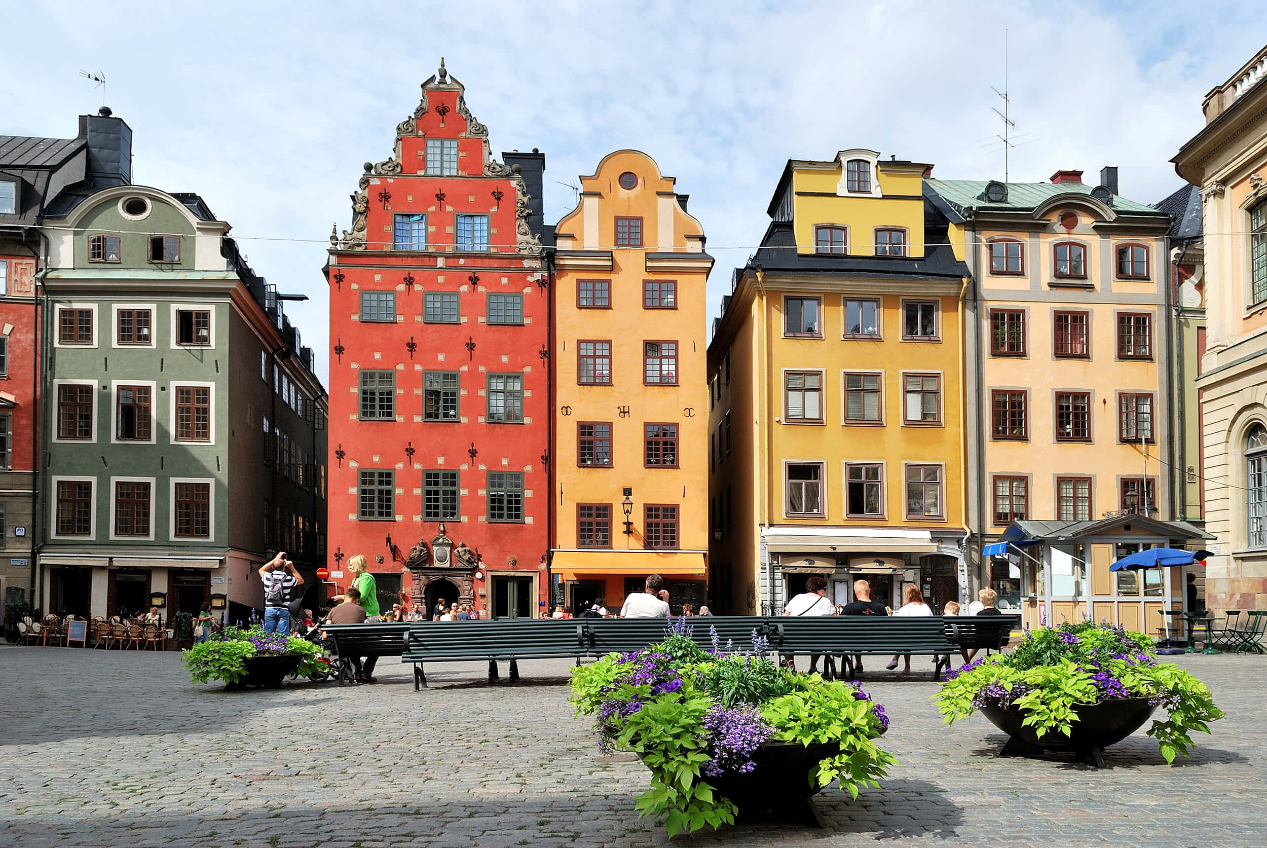 Gamla Stan, cobblestone square, red yellow and green facades, Full HD Desktop Wallpaper