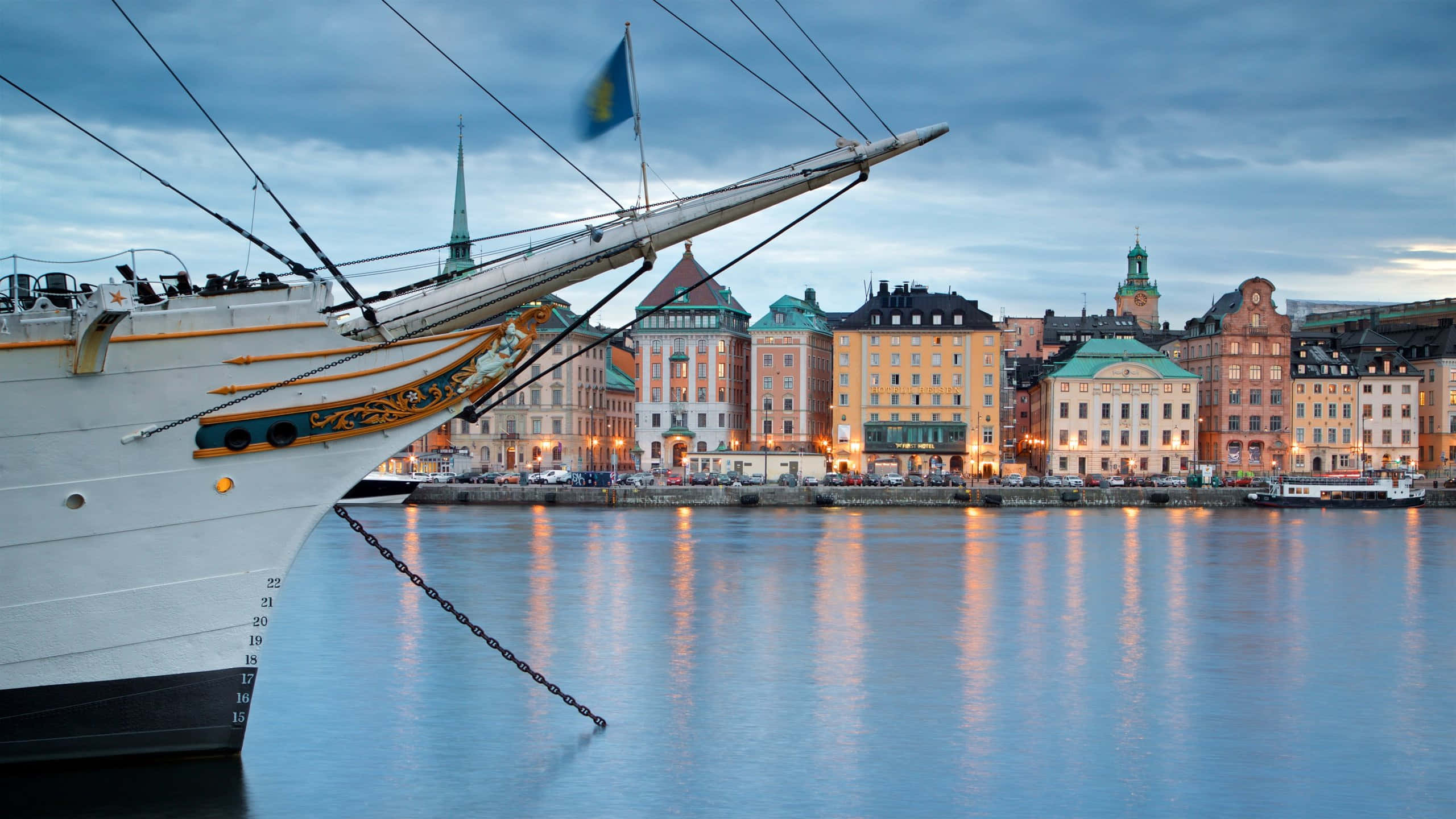 Gamla Stan, ship's bow, calm waters, 2K Desktop Wallpaper