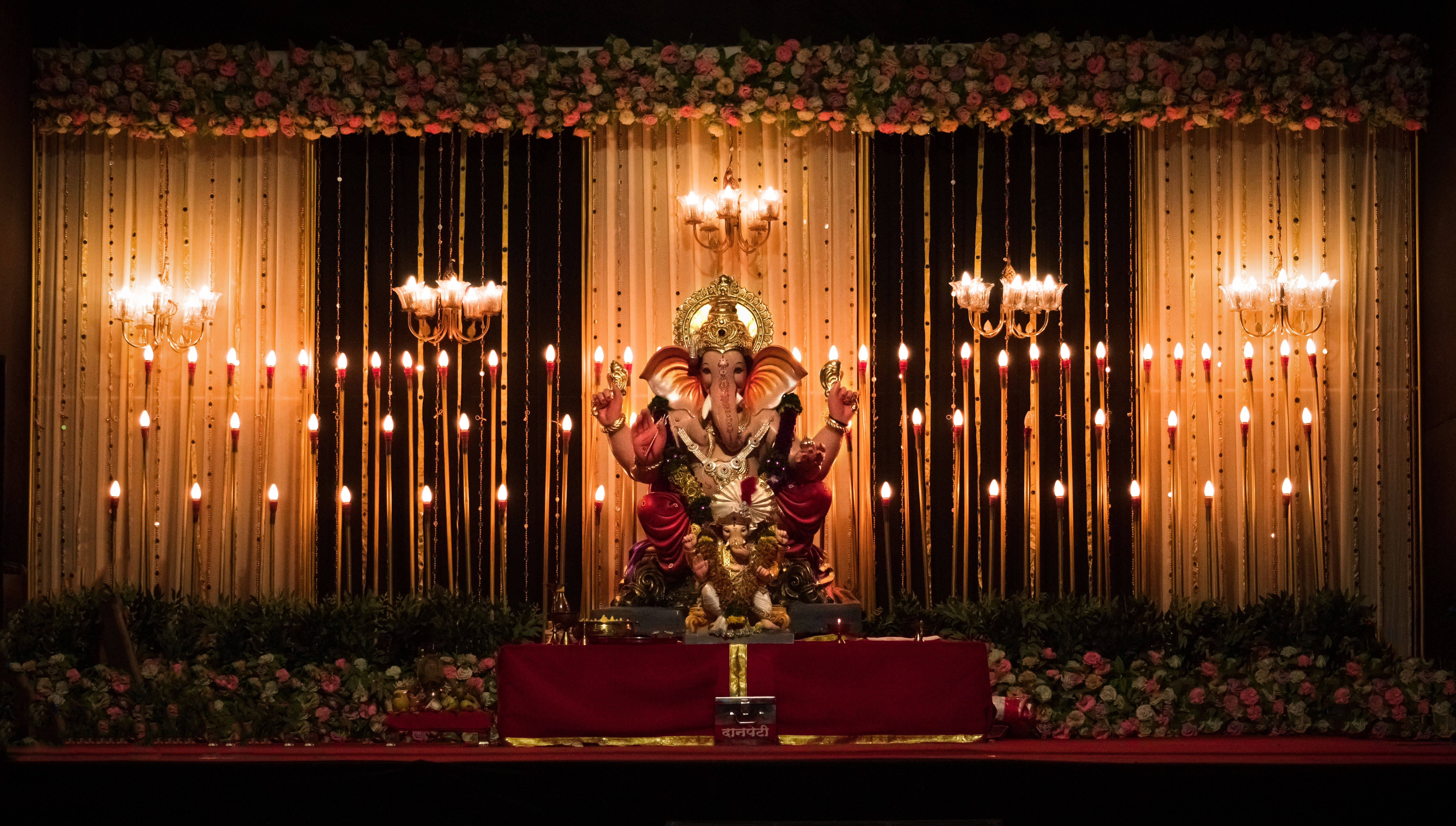 Ganesh Ji, golden Ganesha statue, red dais, 5K Desktop Wallpaper