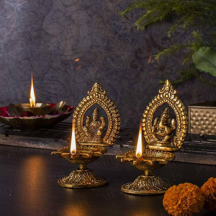 Ganesh Lakshmi, golden oil lamps, deity figures, SD Desktop Wallpaper