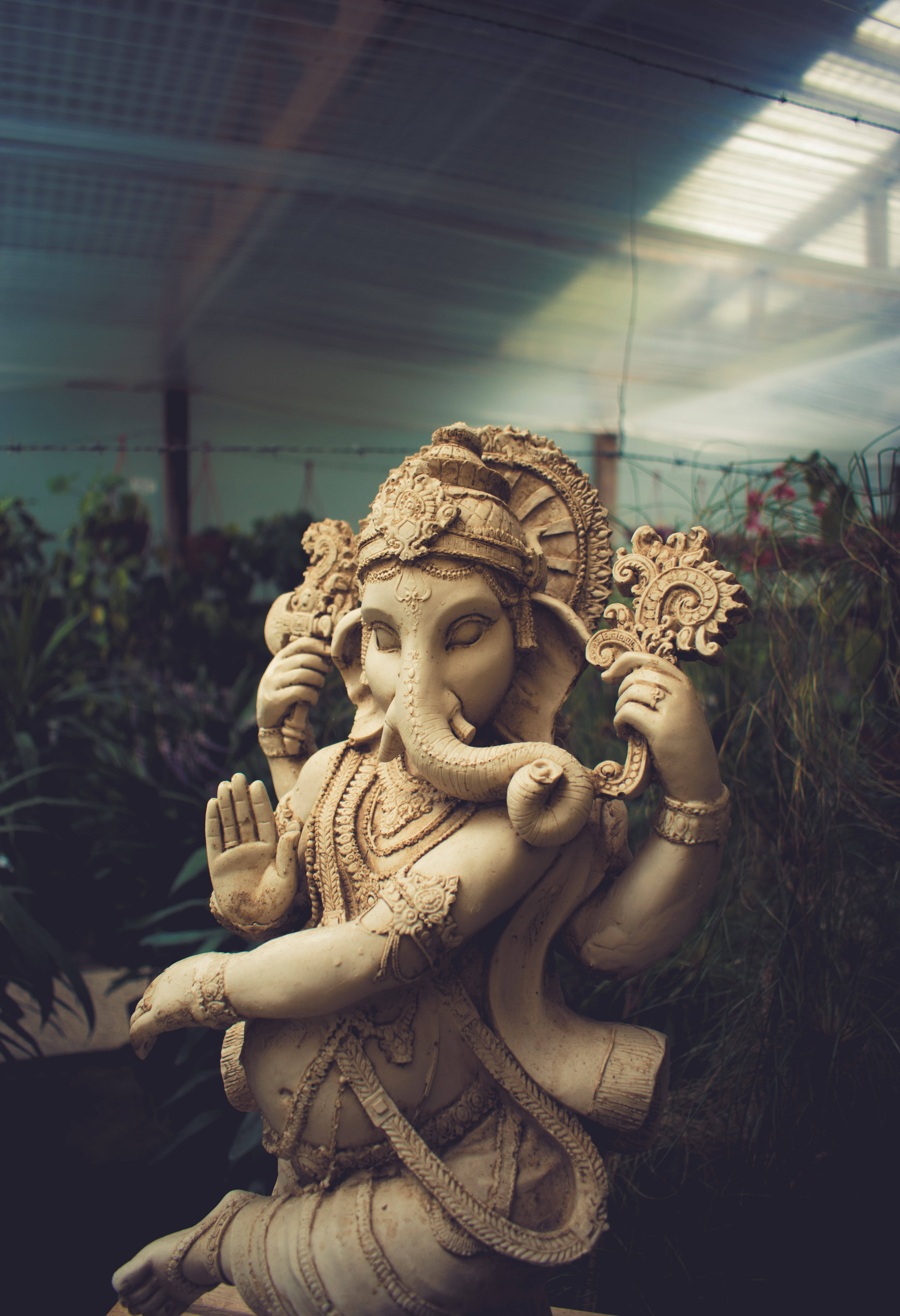 Ganesha, clay statue, lush greenery, 5K Phone Wallpaper