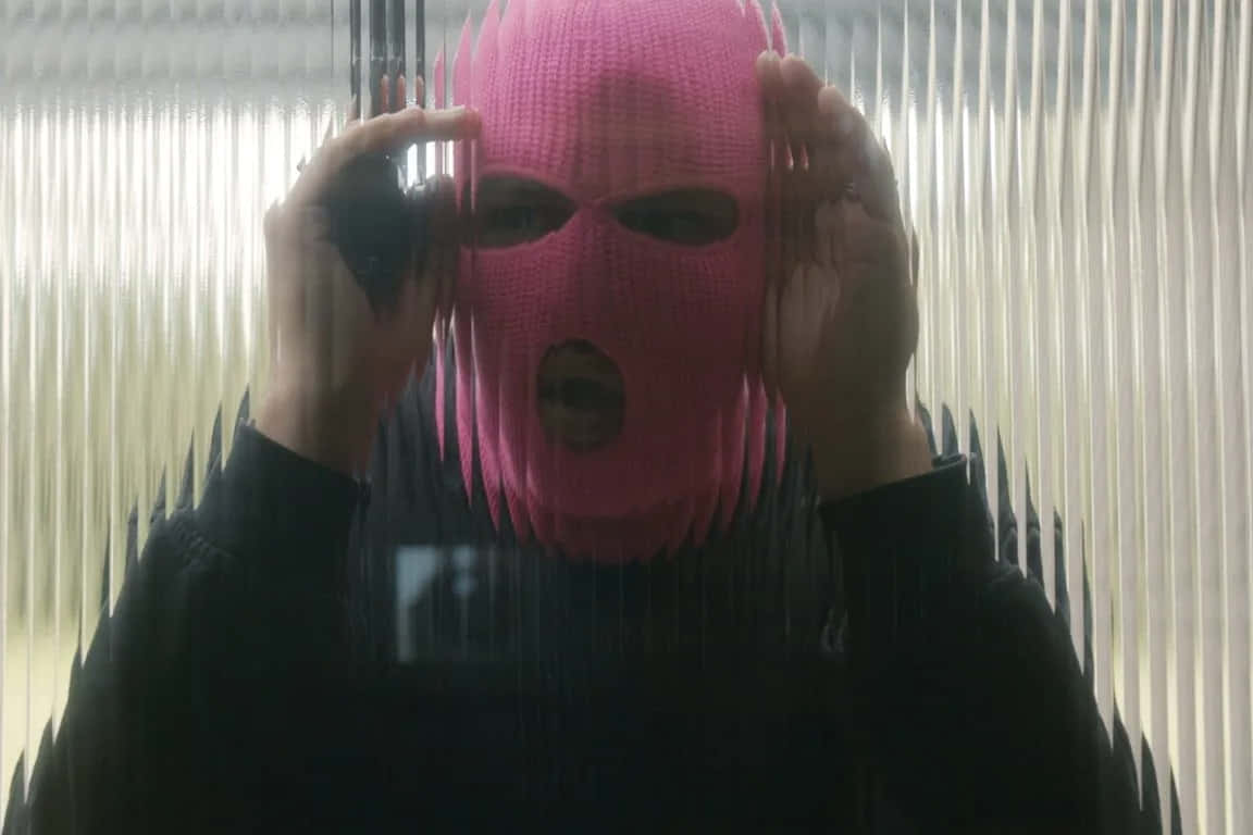 bright pink knitted balaclava, rain-slicked glass pane, vertical blinds, SD Desktop Wallpaper