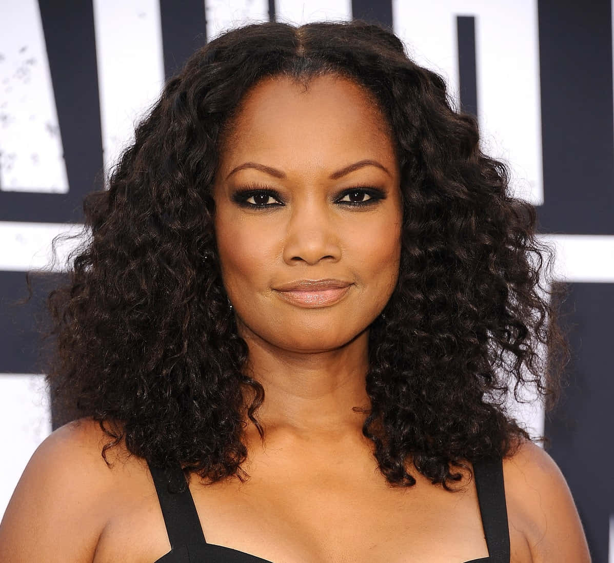 Garcelle Beauvais, black and white striped backdrop, voluminous dark curls, SD Desktop Wallpaper