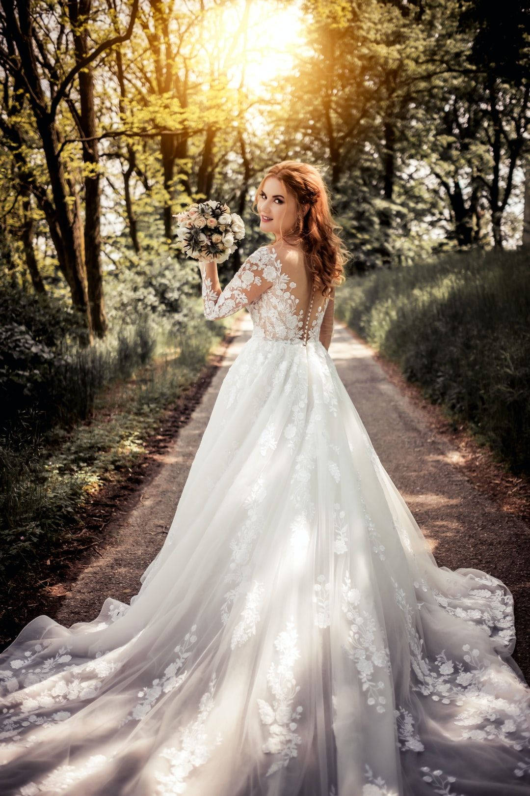 stunning bride, white lace gown, sunlit forest path, HD Phone Wallpaper
