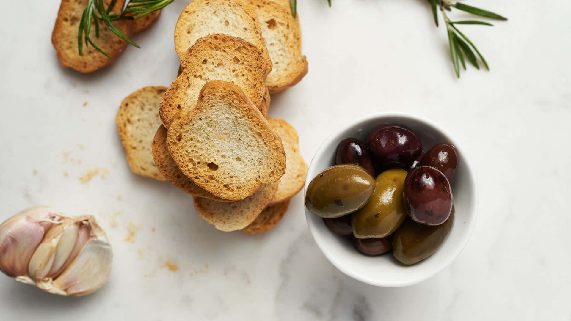 golden toasted bread, glossy black and green olives, white marble surface, Full HD Desktop Wallpaper
