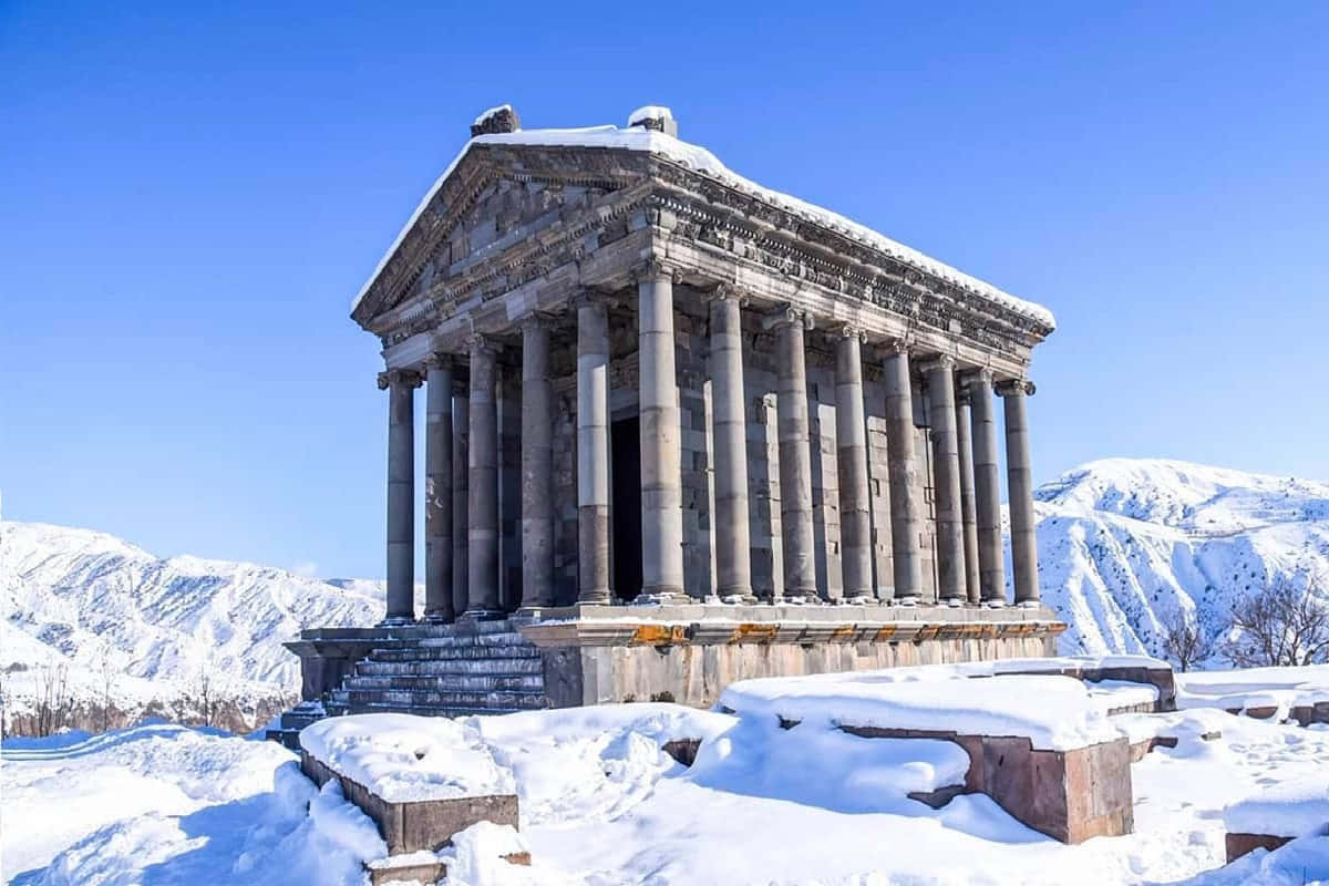 Garni Temple, snow-covered columns, clear blue sky, SD Desktop Wallpaper