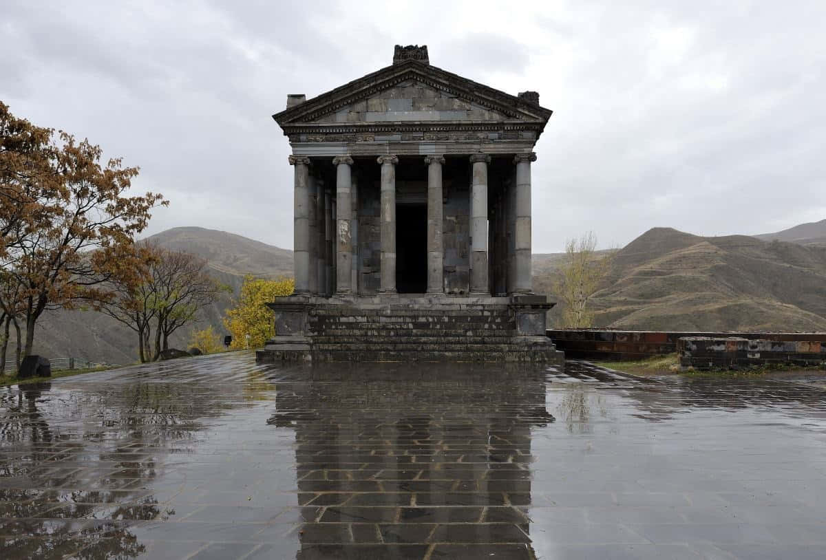 Garni Temple, wet stone plaza, large puddle, SD Desktop Wallpaper