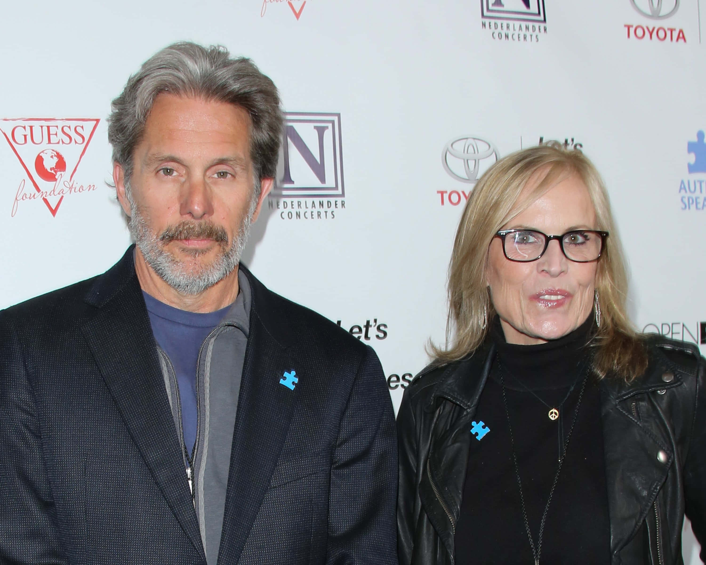 Gary Cole, blue puzzle piece pins, branded backdrop, 2K Desktop Wallpaper