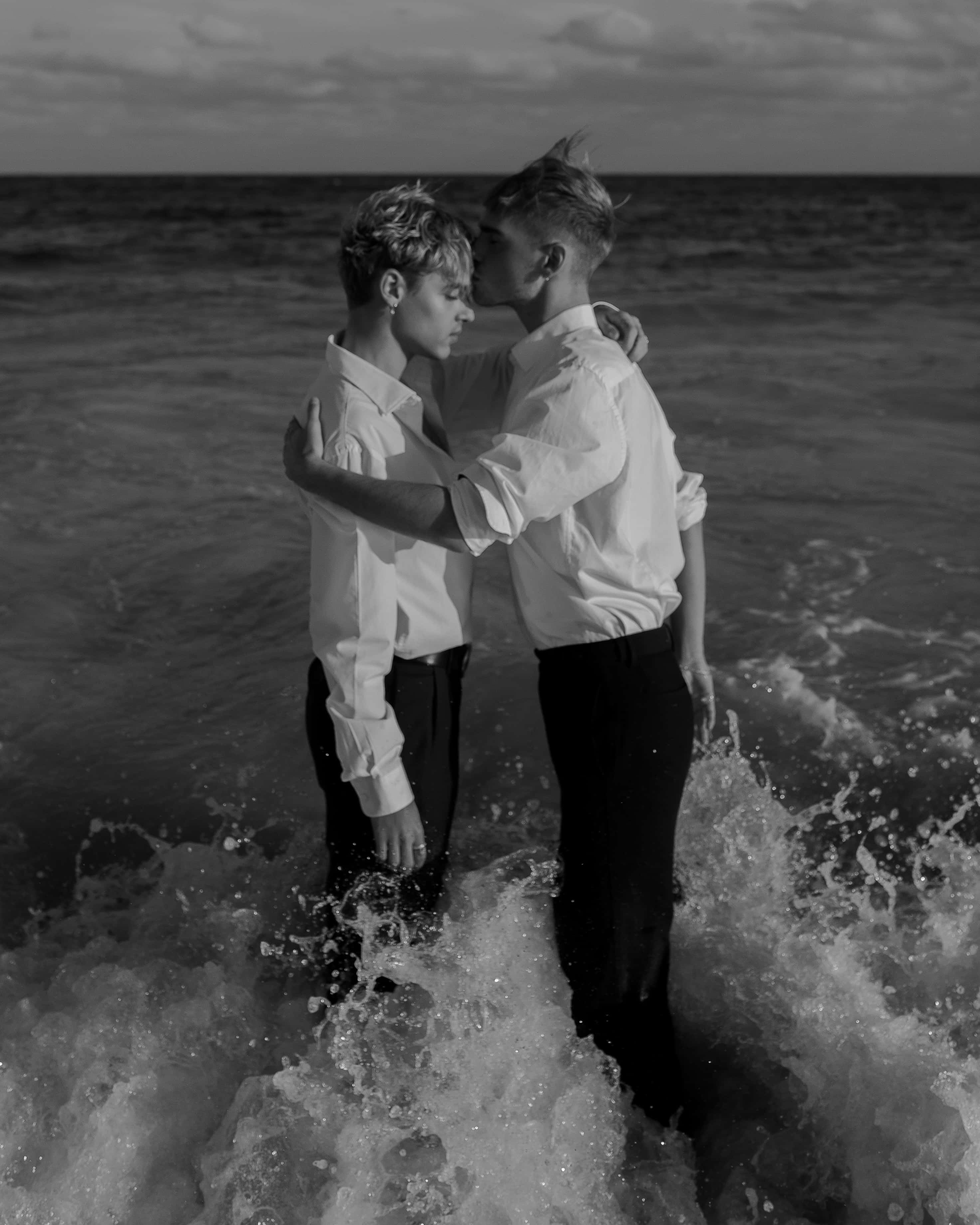 two gay boys, ocean waves, dusk, 2K Phone Wallpaper