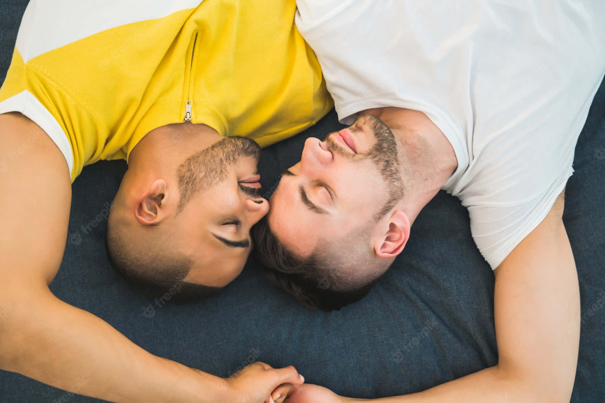 Gay Latino couple, dark couch, casual shirts, Full HD Desktop Wallpaper