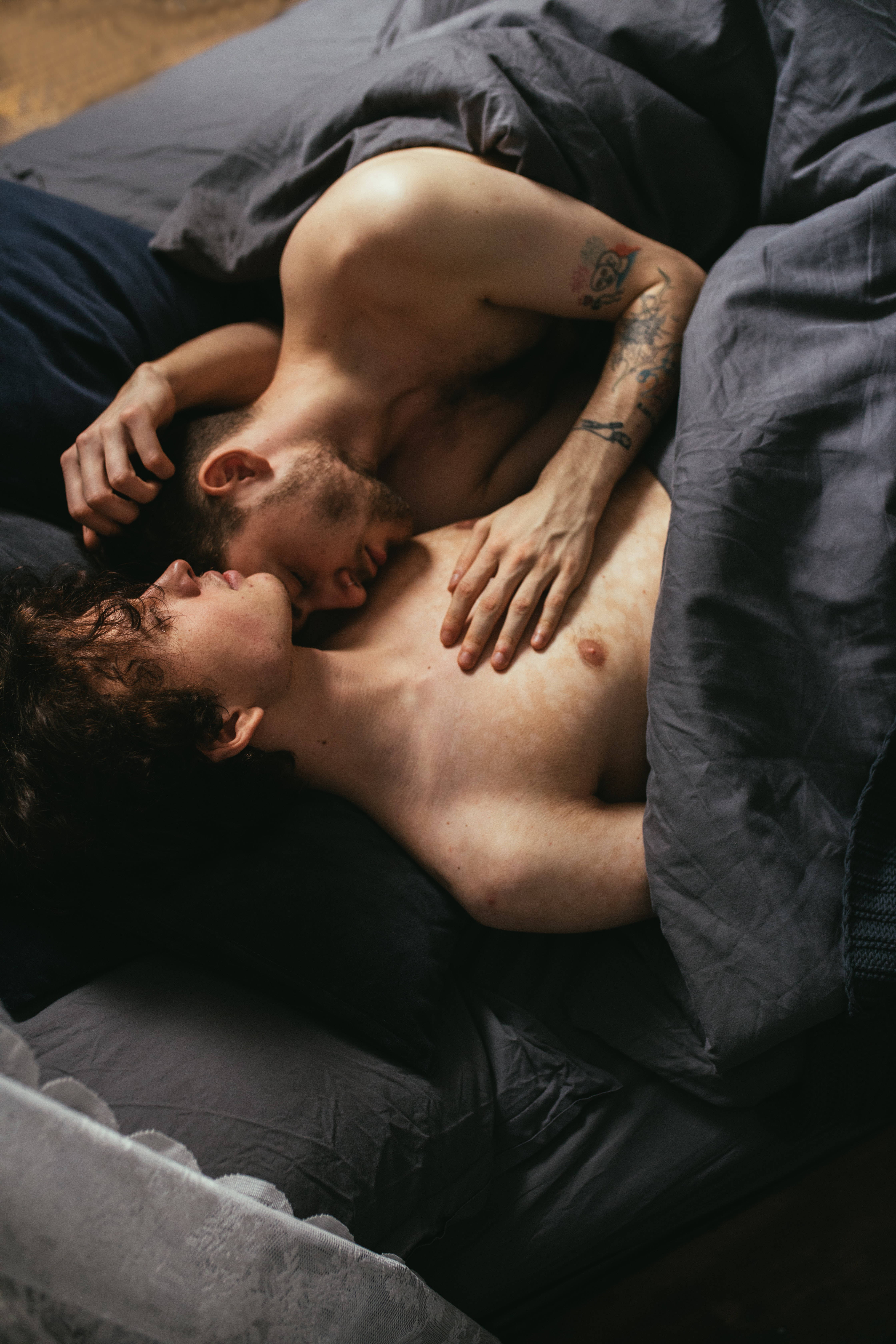 tattoos, dark gray blankets, dimly lit bedroom, 5K Phone Wallpaper
