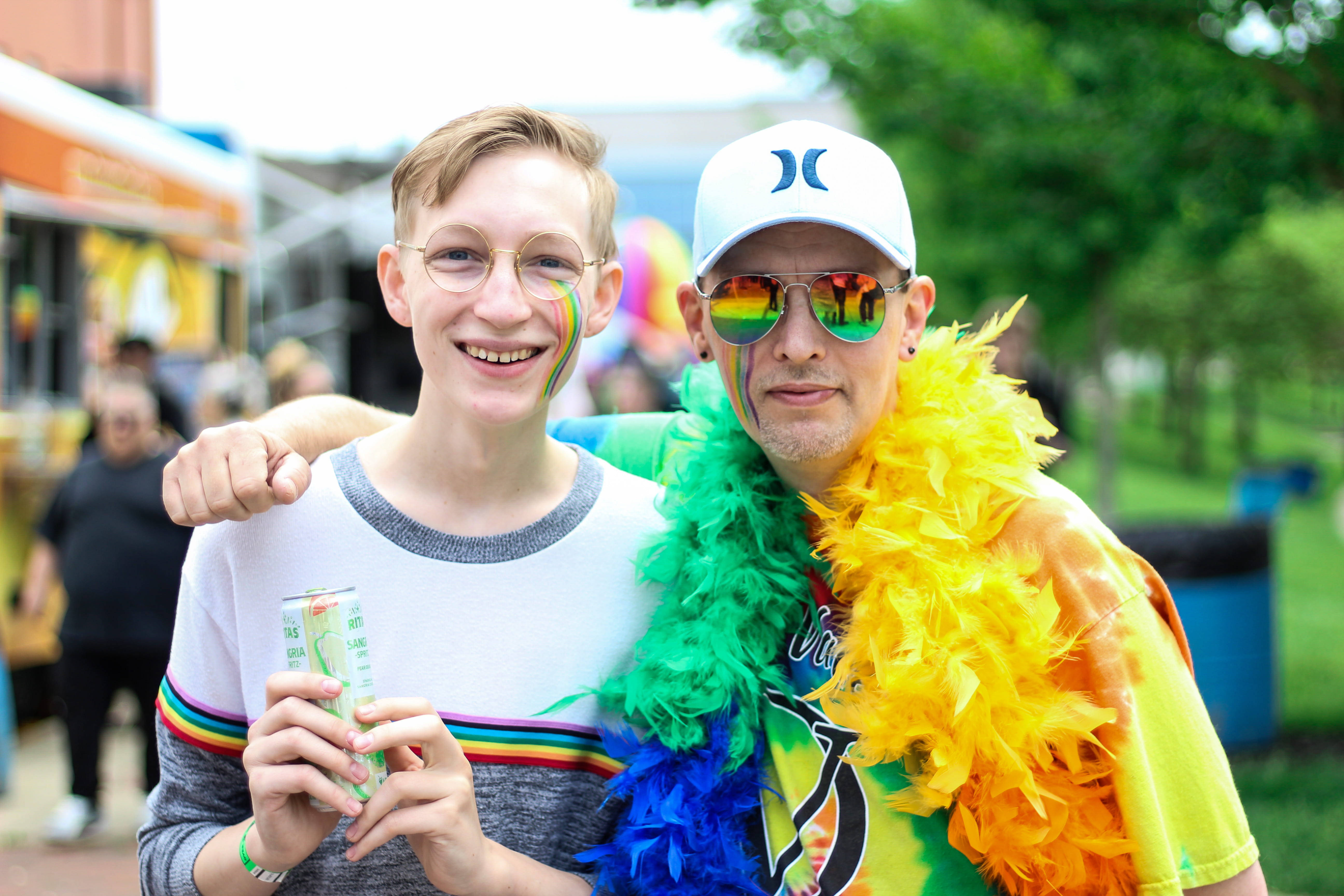Pride march, rainbow face paint, feather boas, 5K Desktop Wallpaper