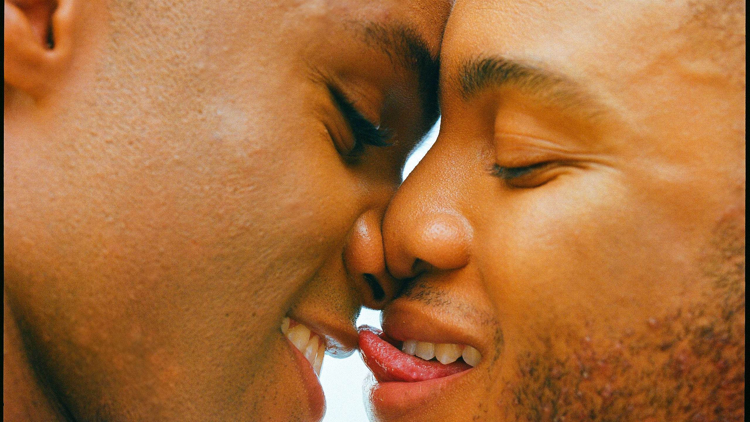 black gay man, closed eyes, noses touch, 2K Desktop Wallpaper