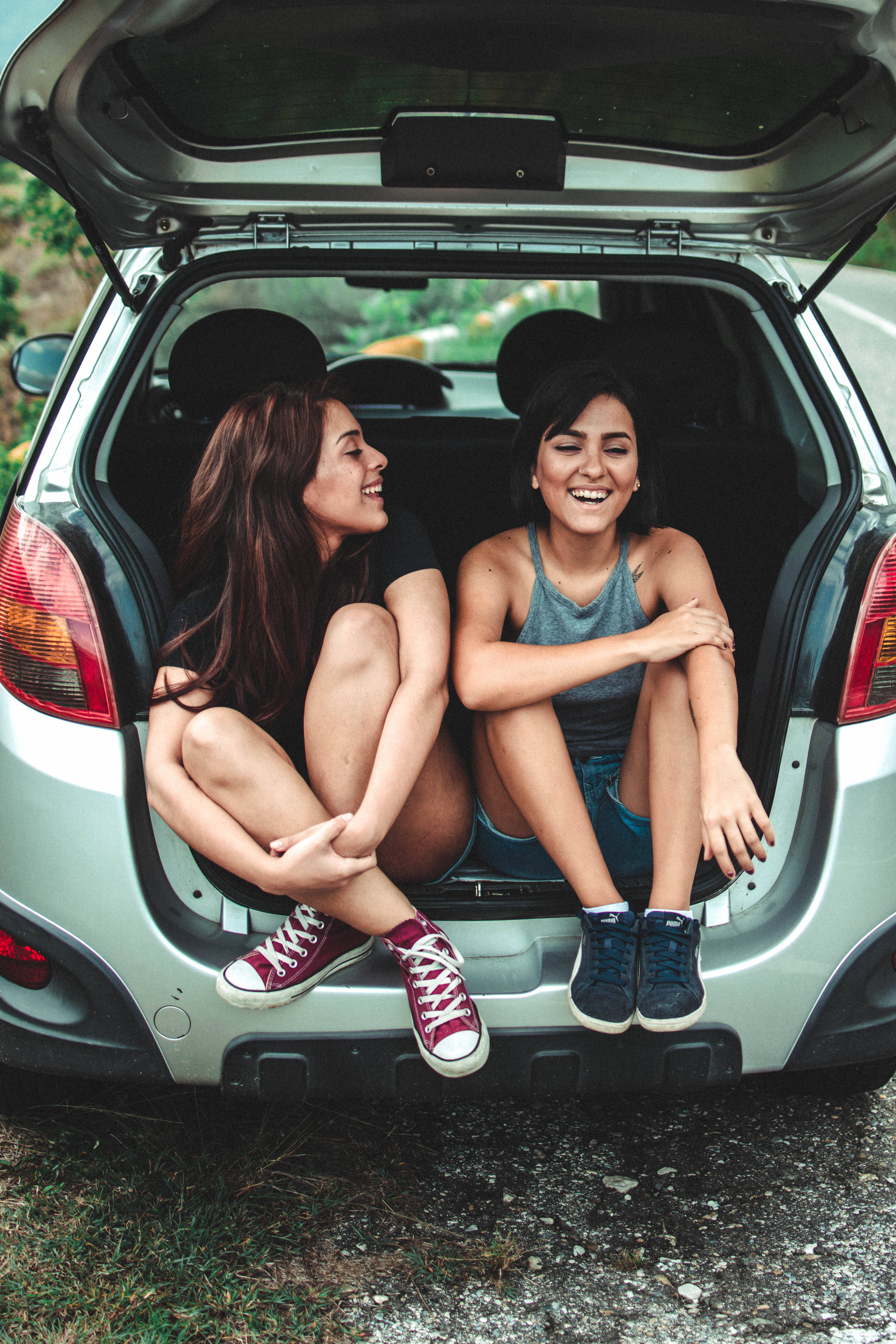silver car, trunk, two smiling young women, 5K Phone Wallpaper