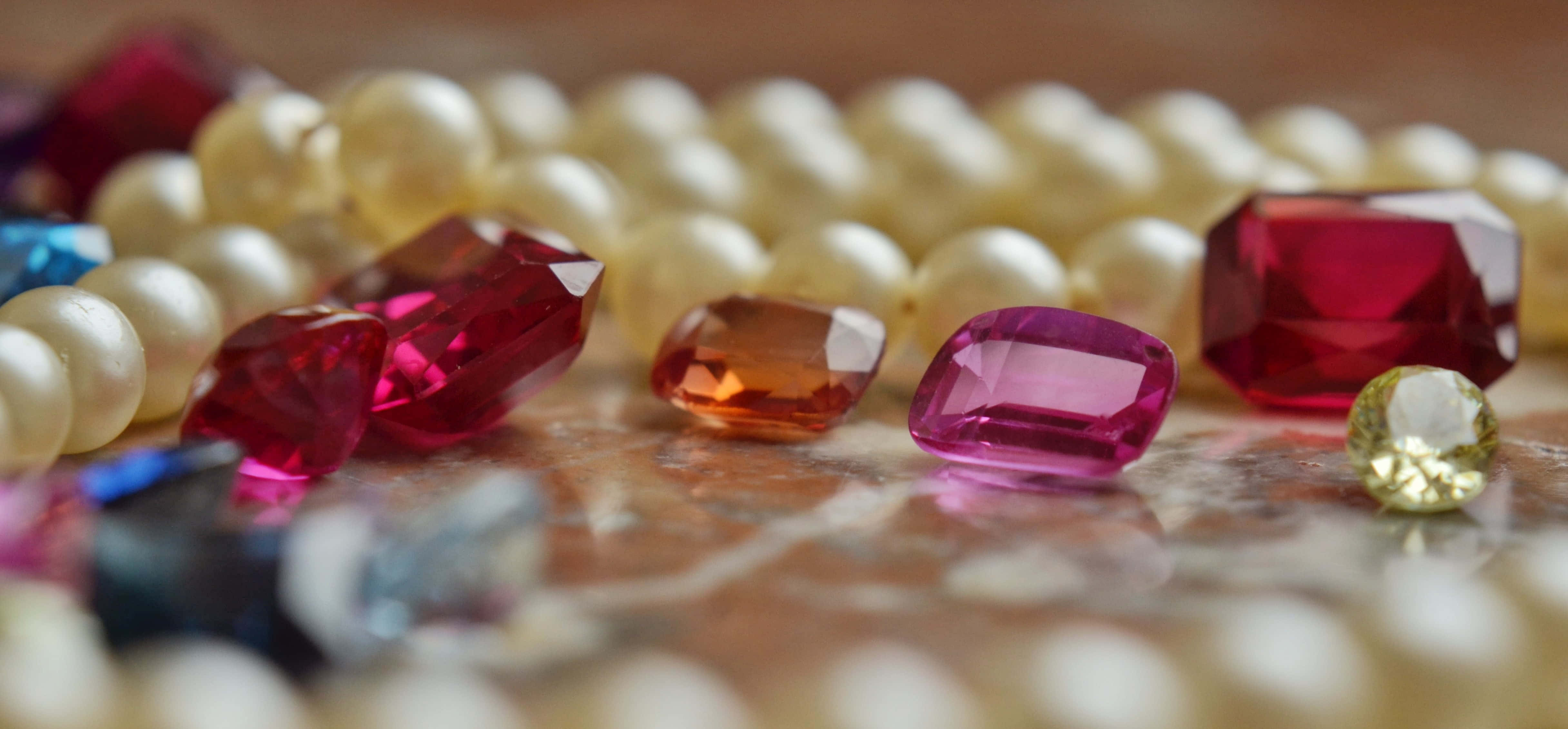 faceted gemstones, creamy pearls, polished marble surface, 4K Desktop Wallpaper