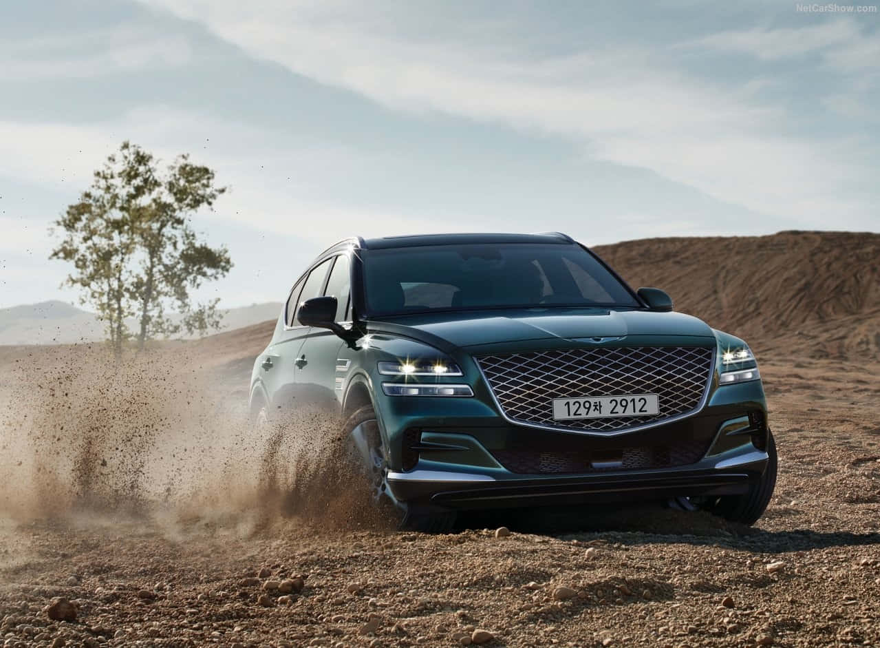 Genesis GV80, sleek green SUV, dusty terrain, SD Desktop Wallpaper