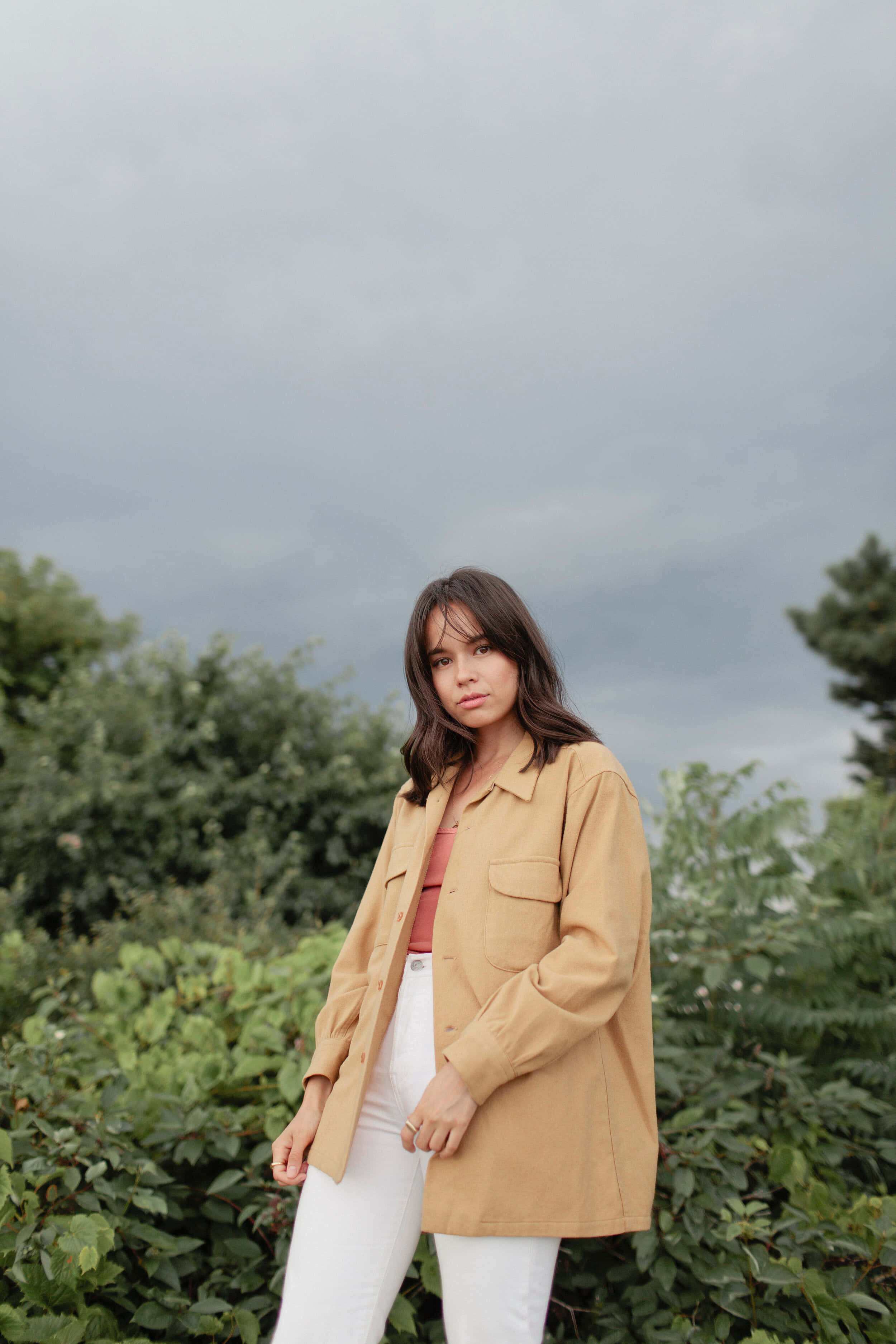 Genevieve Kang, tan shirt, white pants, 2K Phone Wallpaper