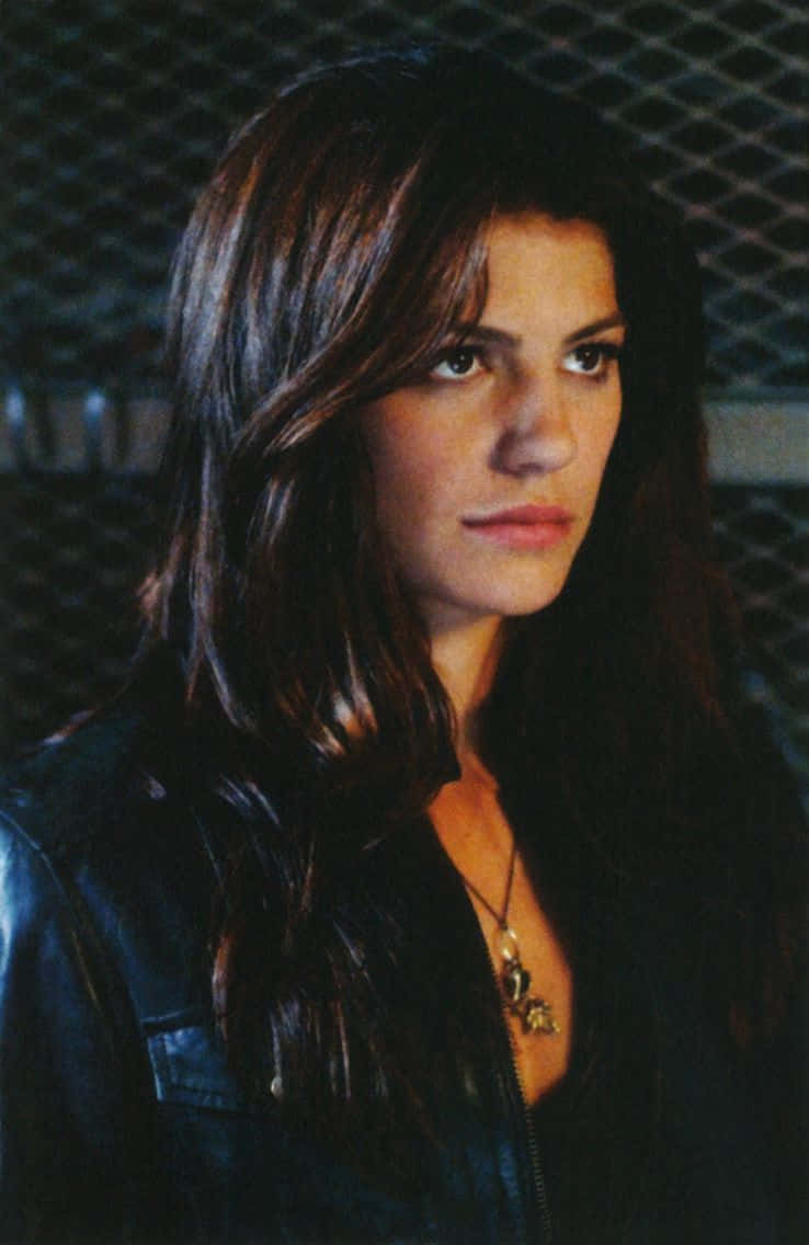 Genevieve Padalecki, black leather jacket, chain-link fence, SD Phone Wallpaper