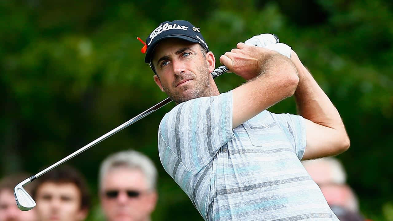 Geoff Ogilvy, mid-swing, lush green course, HD Desktop Wallpaper
