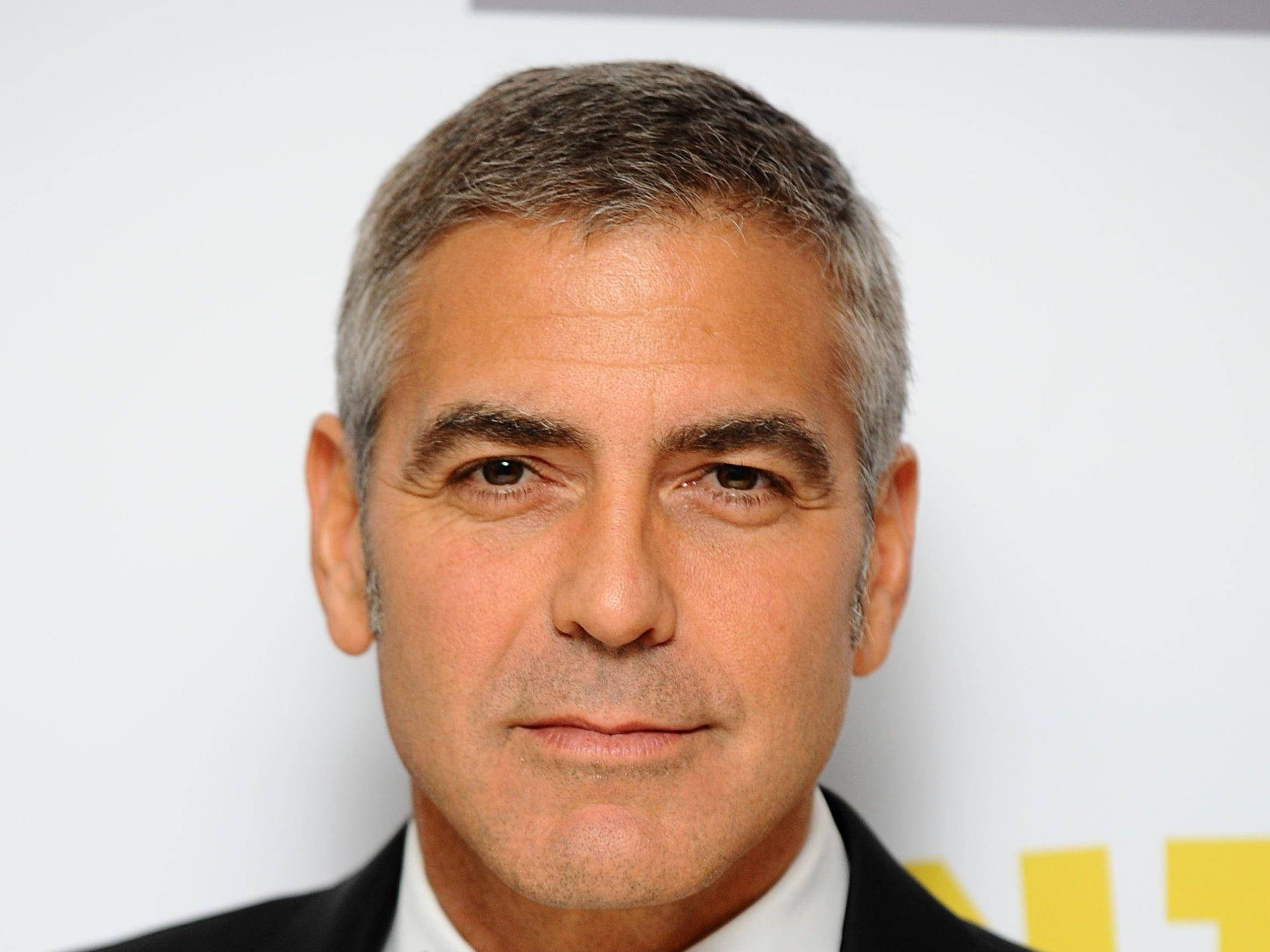 George Clooney, gray hair, serious expression, 2K Desktop Wallpaper