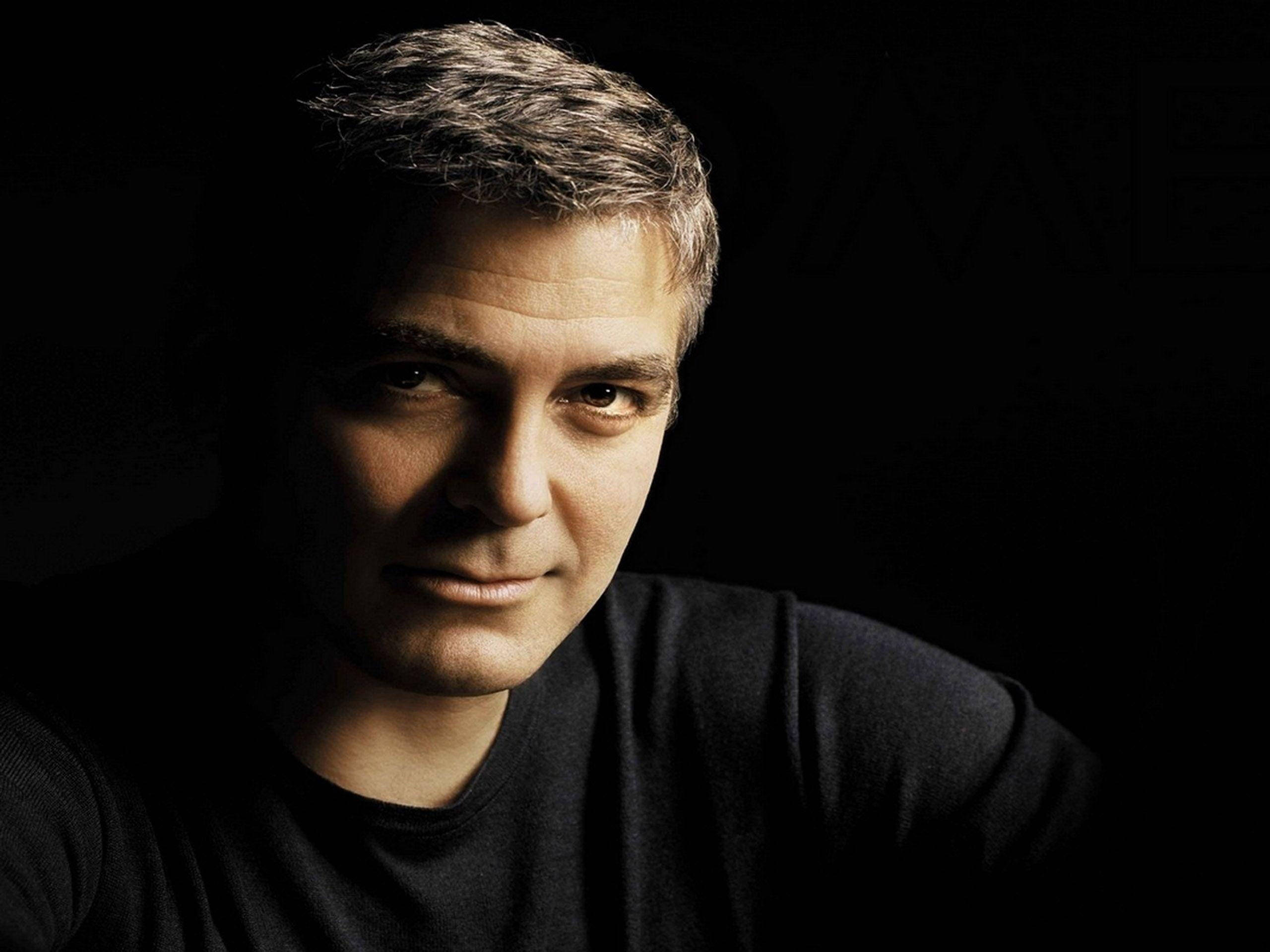 George Clooney, black background, soft light, 2K Desktop Wallpaper