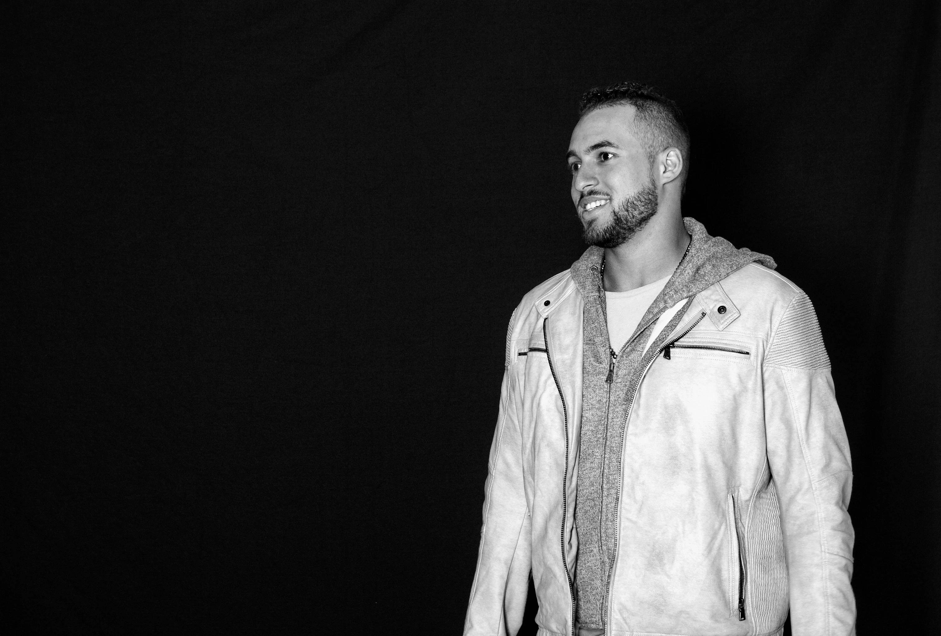 George Springer, leather jacket, stark black background, 2K Desktop Wallpaper