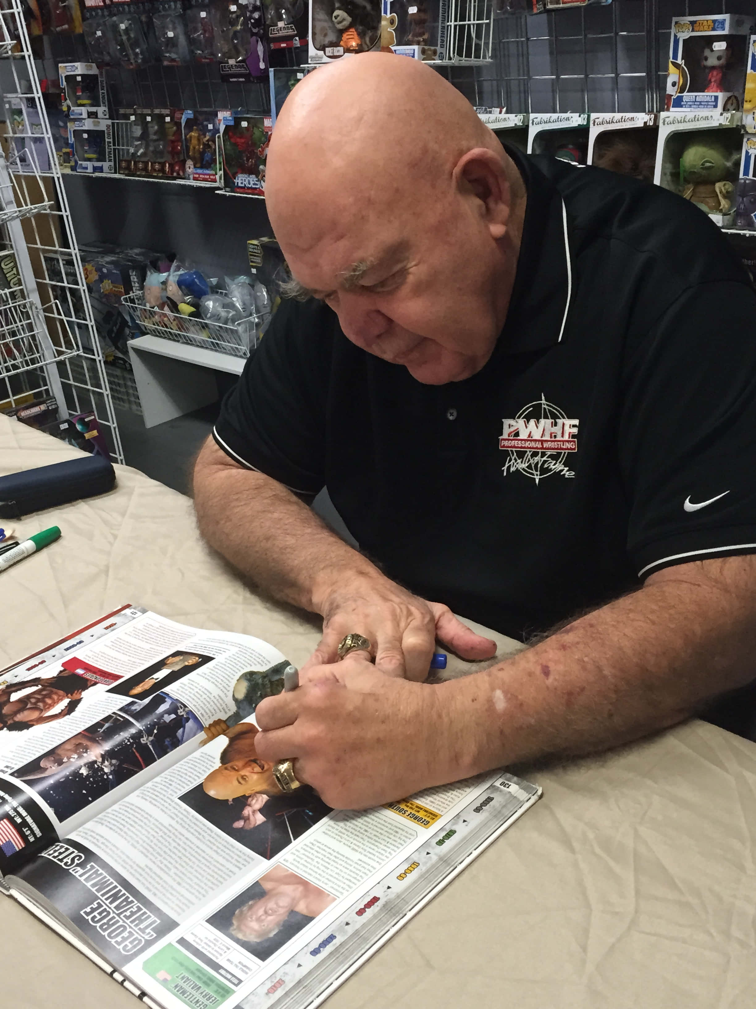 George Steele, black polo shirt, pen, 2K Phone Wallpaper