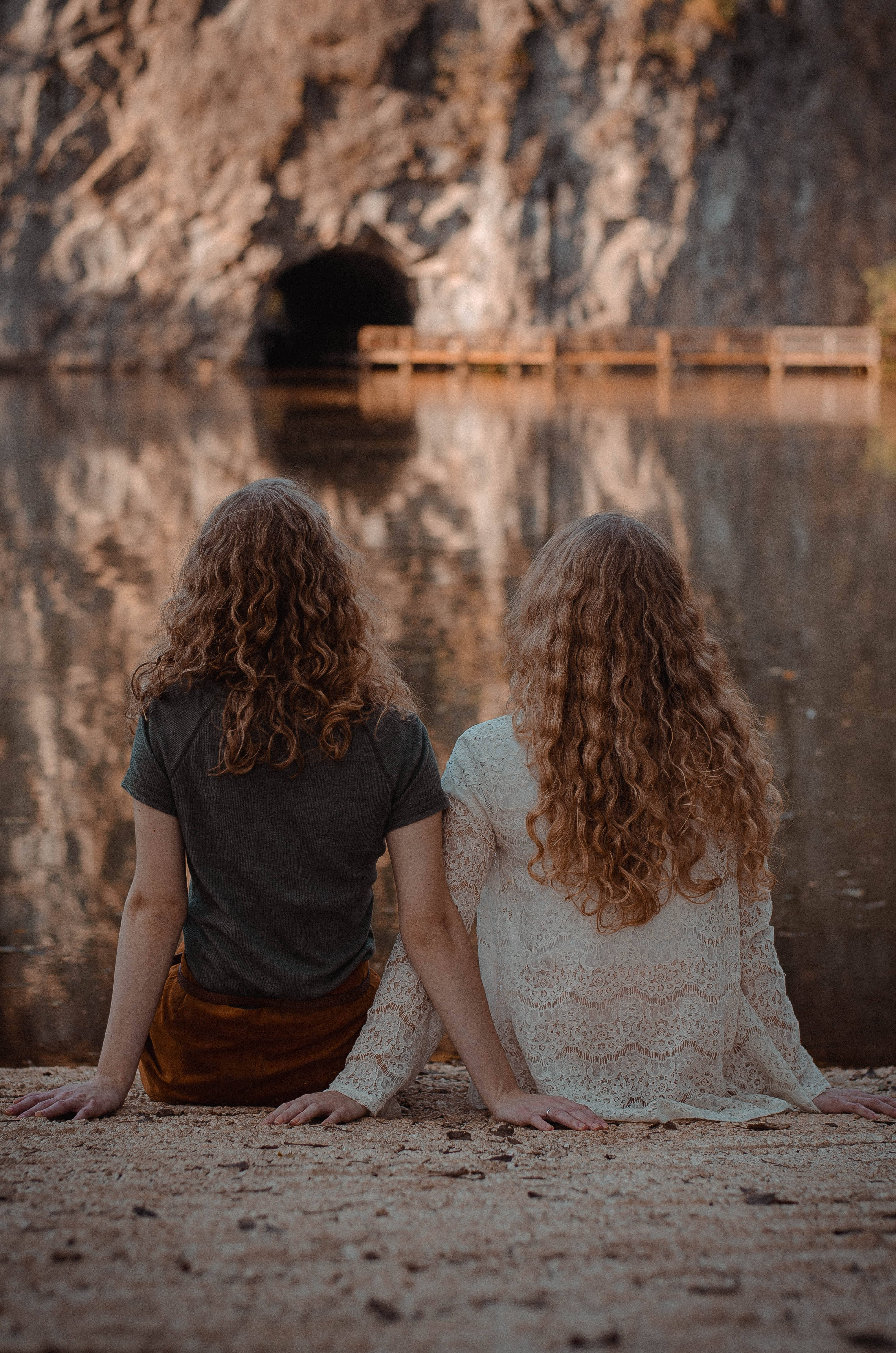 German Girl, curly hair, rocky shore, 4K Phone Wallpaper