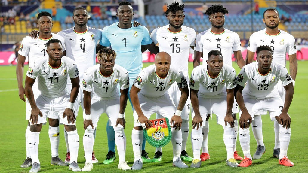 Ghana National Football Team, white jerseys, vibrant green pitch, SD Desktop Wallpaper