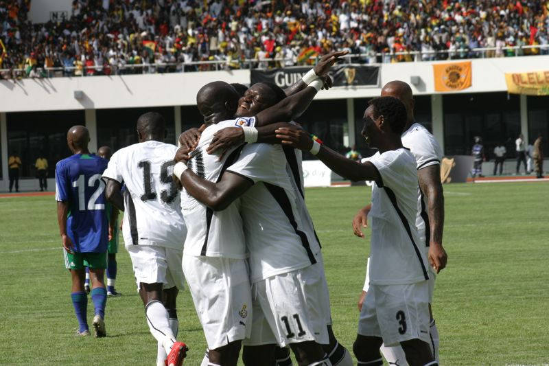 Ghana National Football Team, white jerseys, sunlit green pitch, SD Desktop Wallpaper