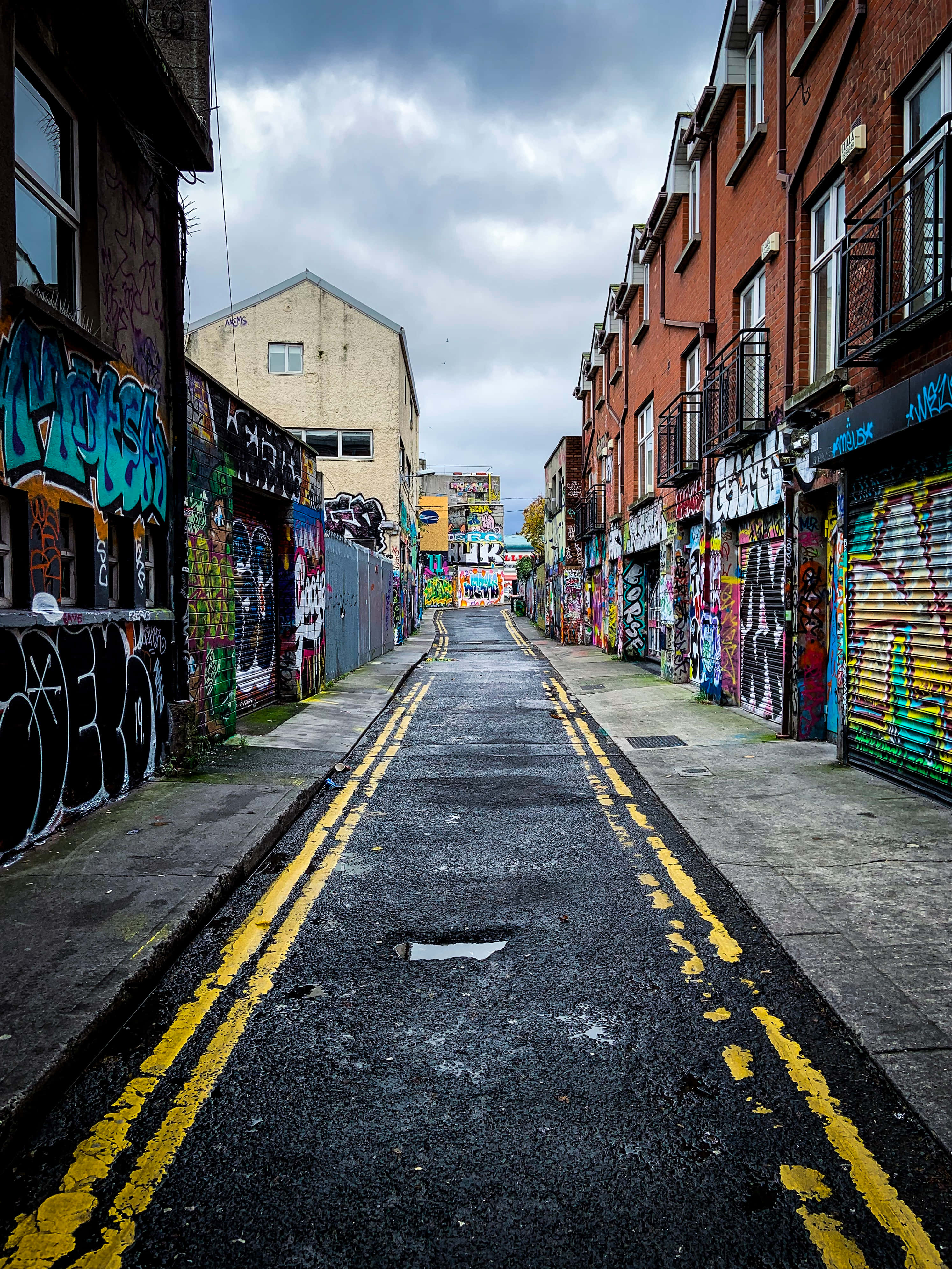 Ghetto Hood, graffiti-covered walls, narrow urban alleyway, 4K Phone Wallpaper