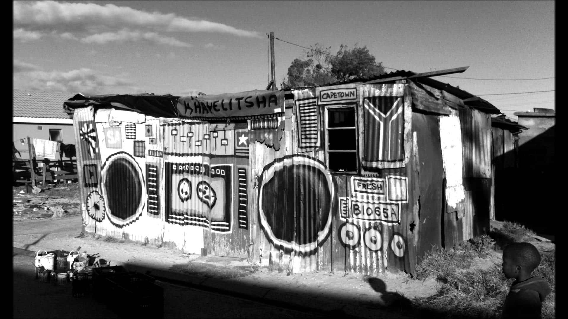 black and white photo, corrugated metal shack, bold graffiti and street art, Full HD Desktop Wallpaper