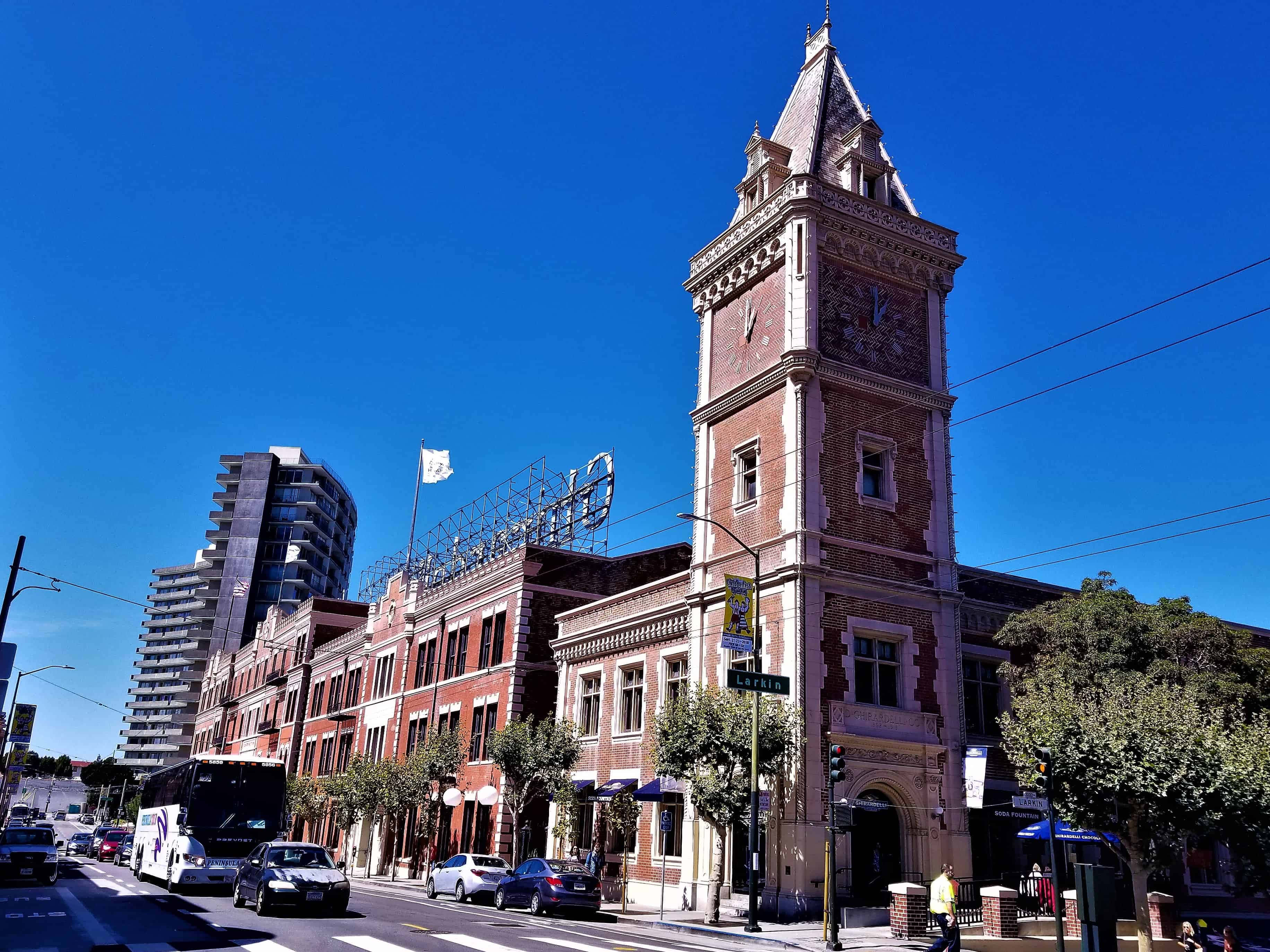 Ghiradelli Square, red brick clock tower, modern glass skyscrapers, 2K Desktop Wallpaper