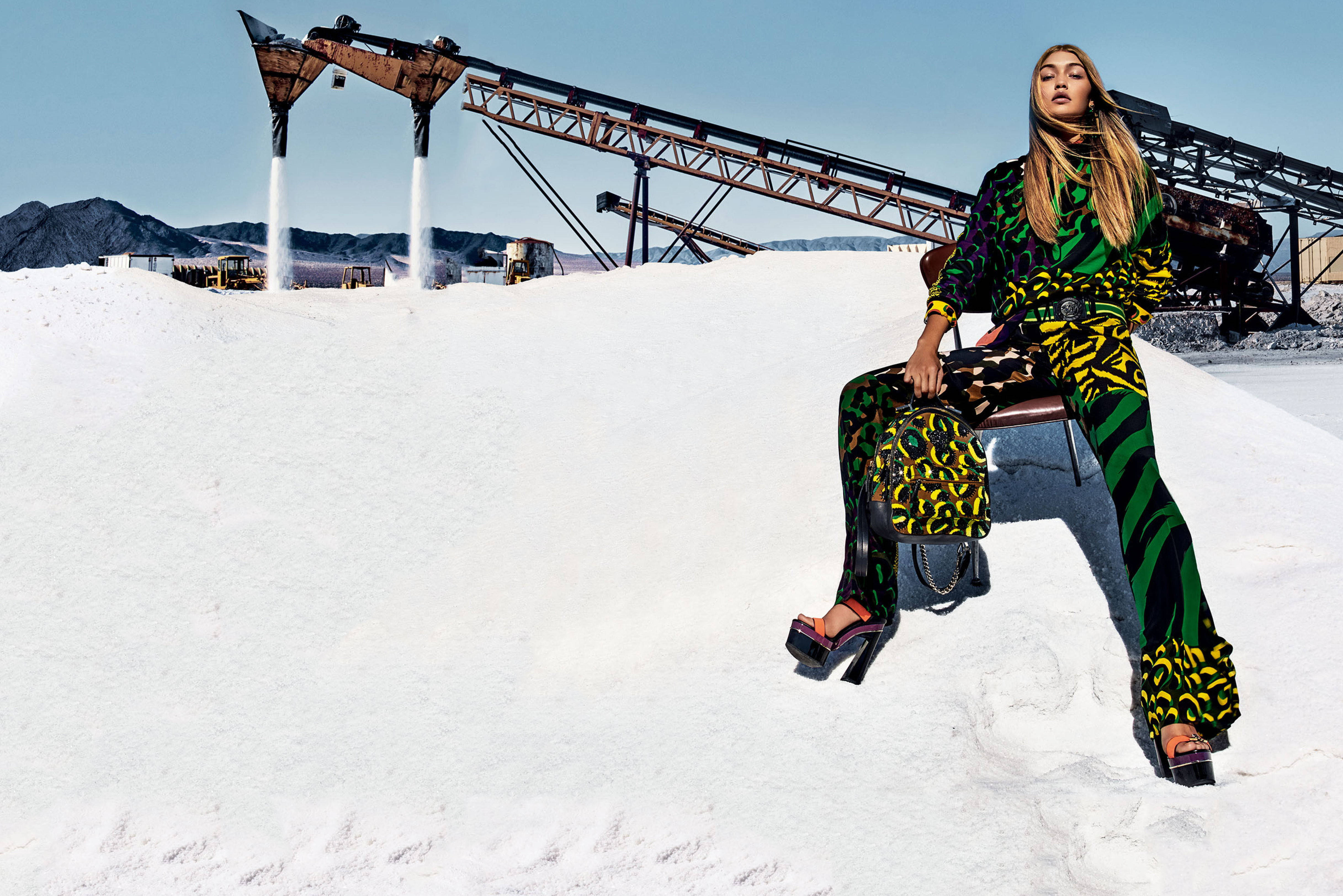 Gigi Hadid, bold green yellow patterned outfit, massive white salt pile, 4K Desktop Wallpaper