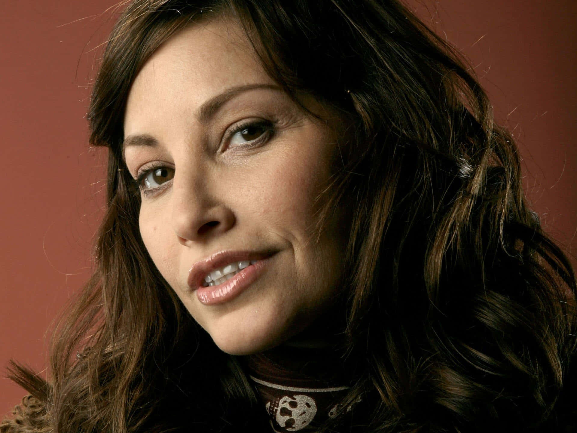 Gina Gershon, wavy brown hair, soft smile, Full HD Desktop Wallpaper